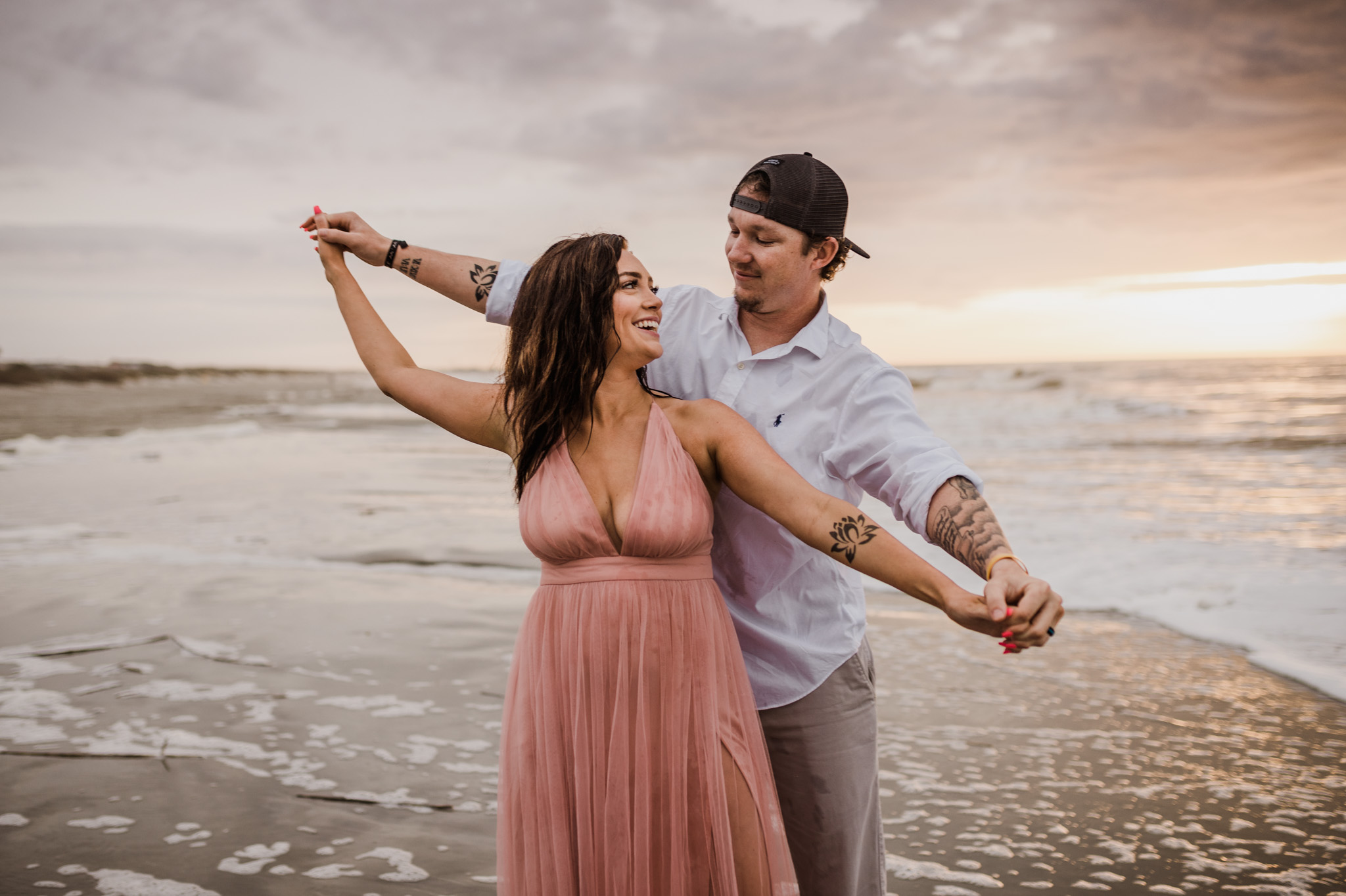 A couple embraces during their Folly Beach engagement session
