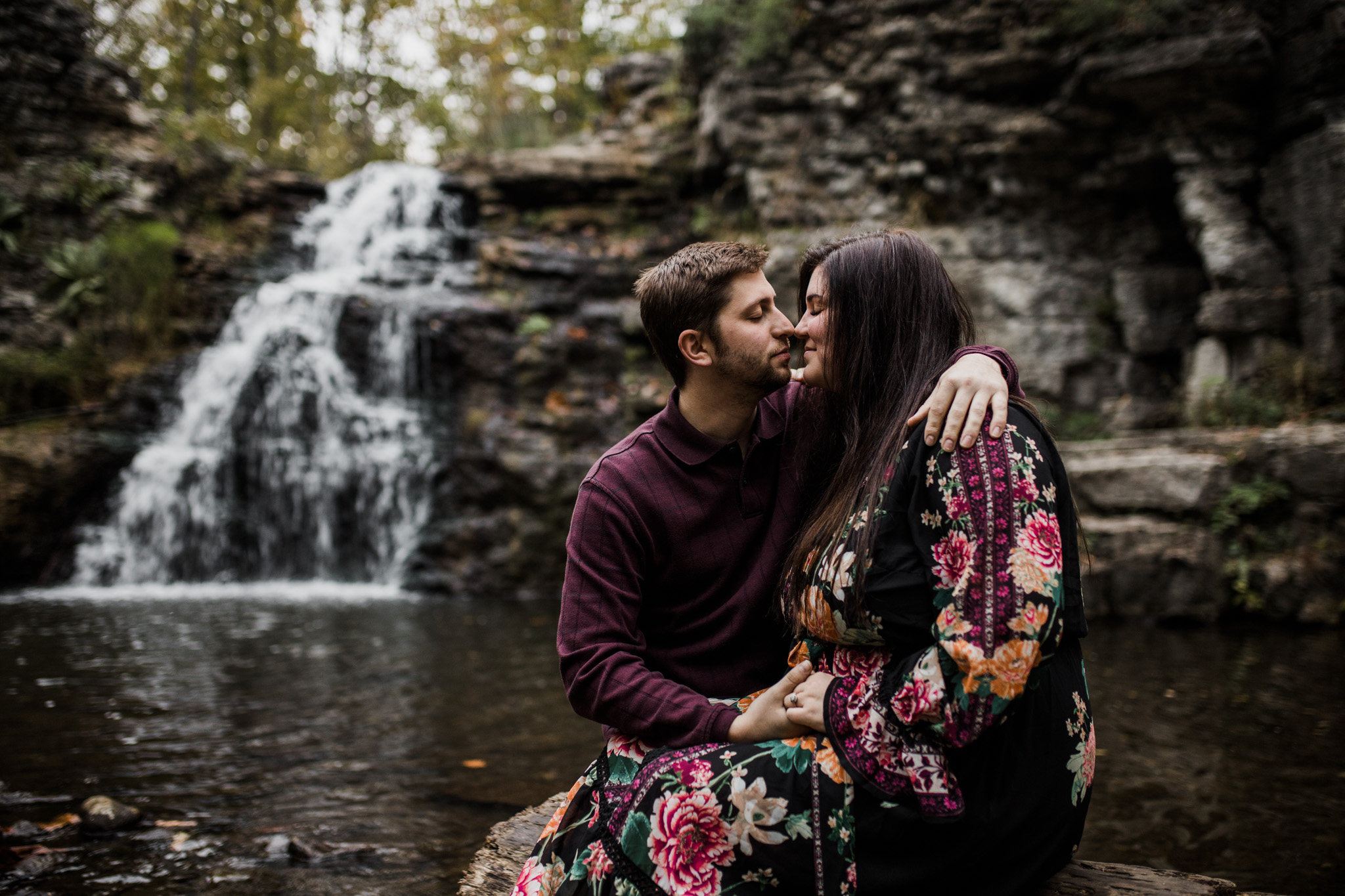 A moody couple's session at France Park, Indiana. Tucked unto the cove by the rushing waterfall on a summer evening.
