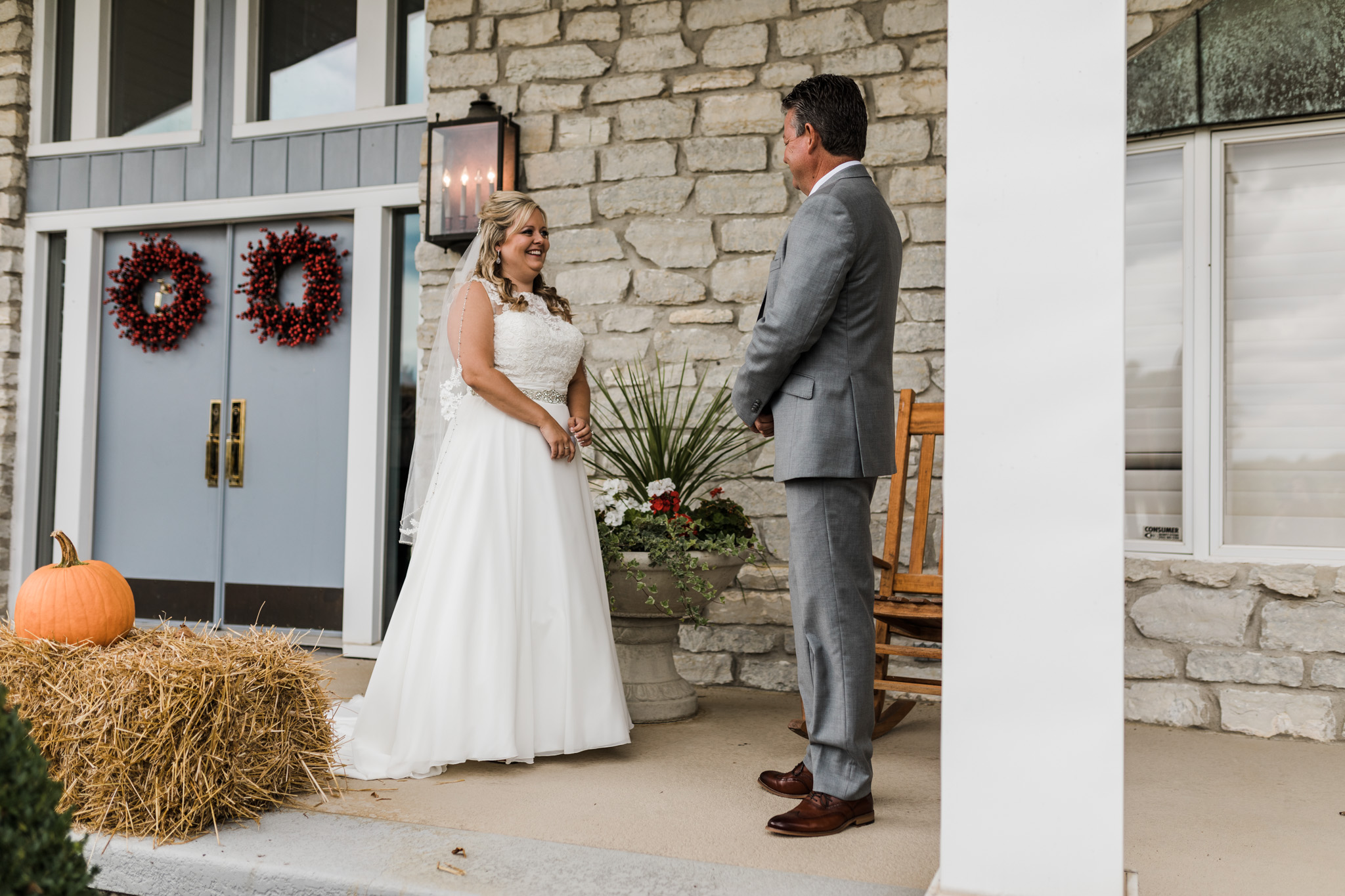 A bride's first look with her dad during a horse farm wedding in Indiana.