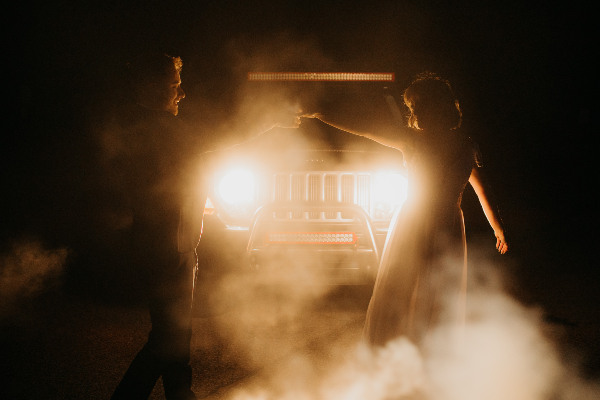 Elopement first dance in front of Jeep headlights