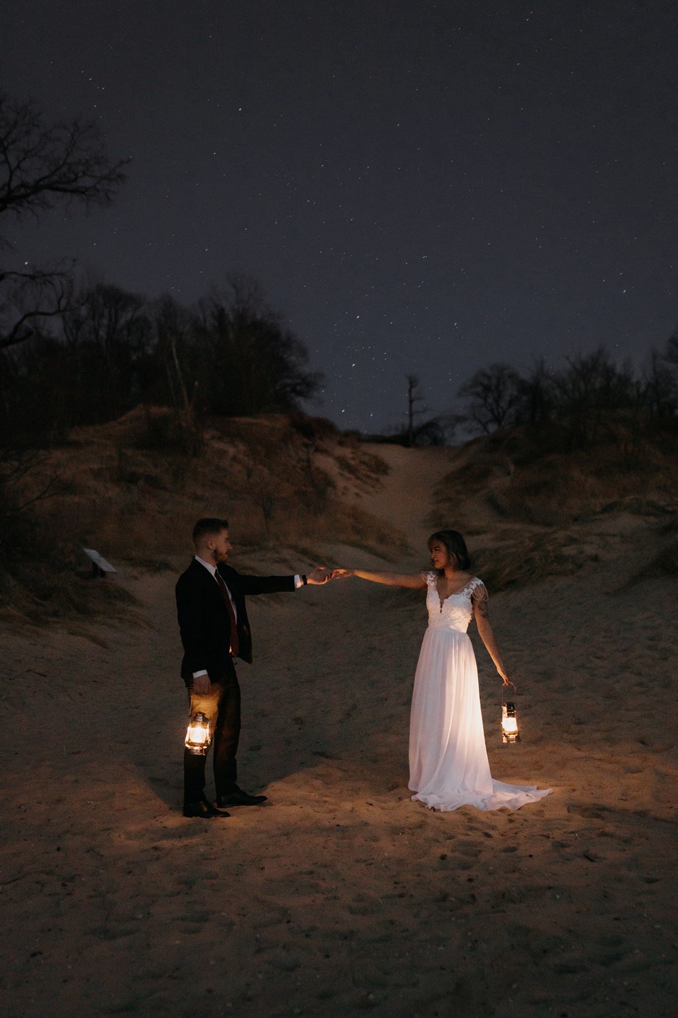 Starry elopement photos with lanterns at the dunes