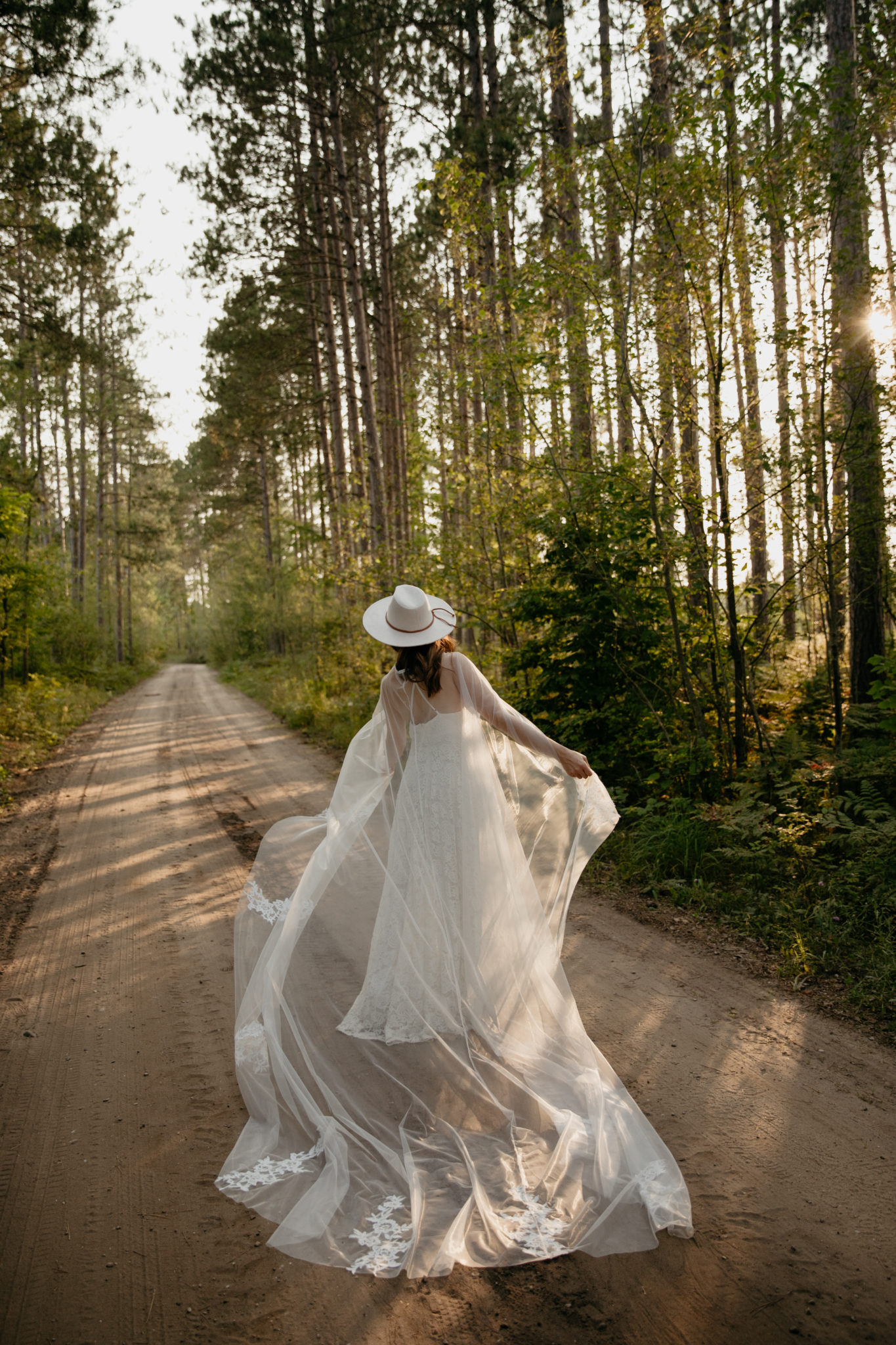 The prettiest boho bride with a wedding cape // Michigan Manistee Forest Elopement