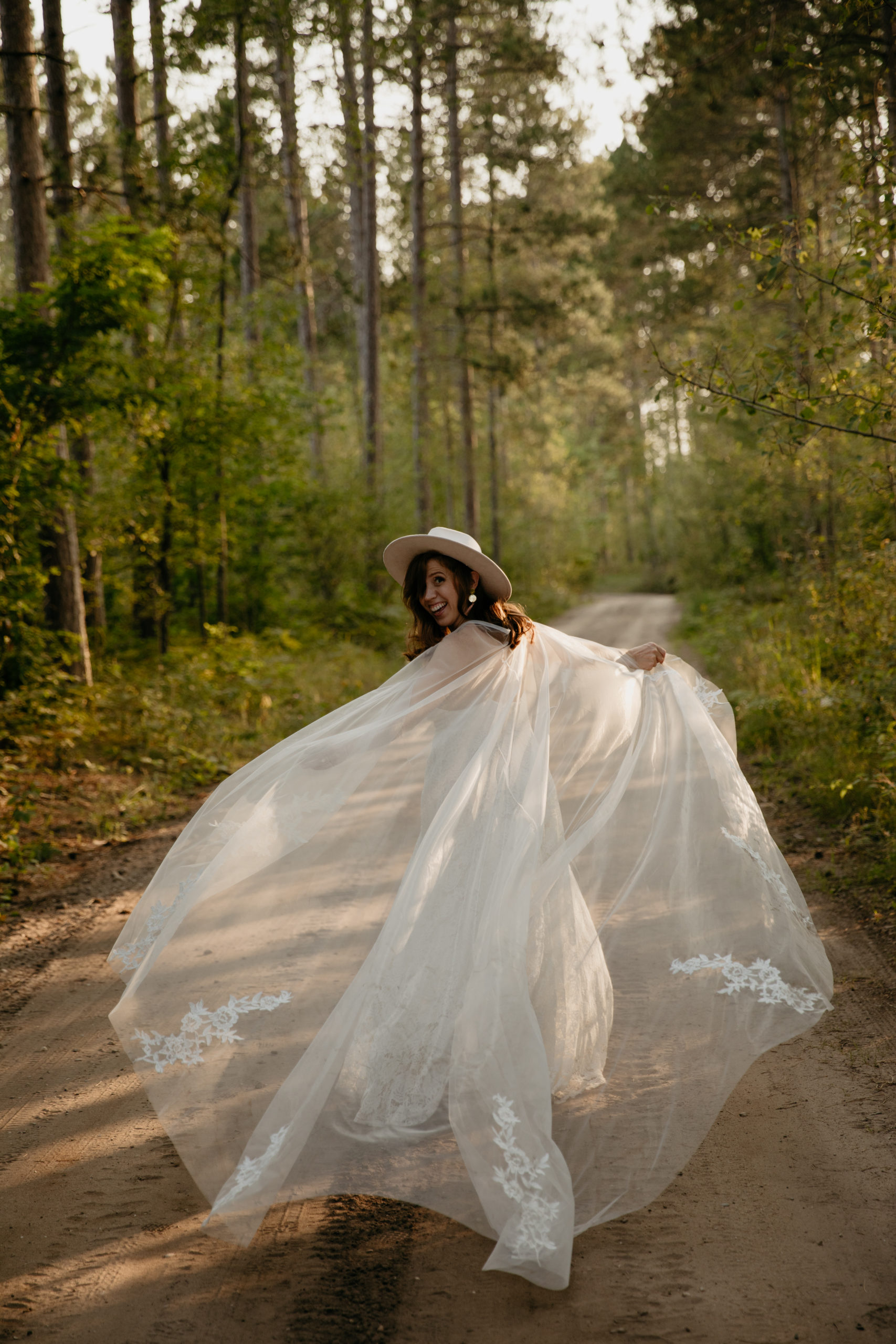 The prettiest boho bride with a wedding cape // Michigan Manistee Forest Elopement