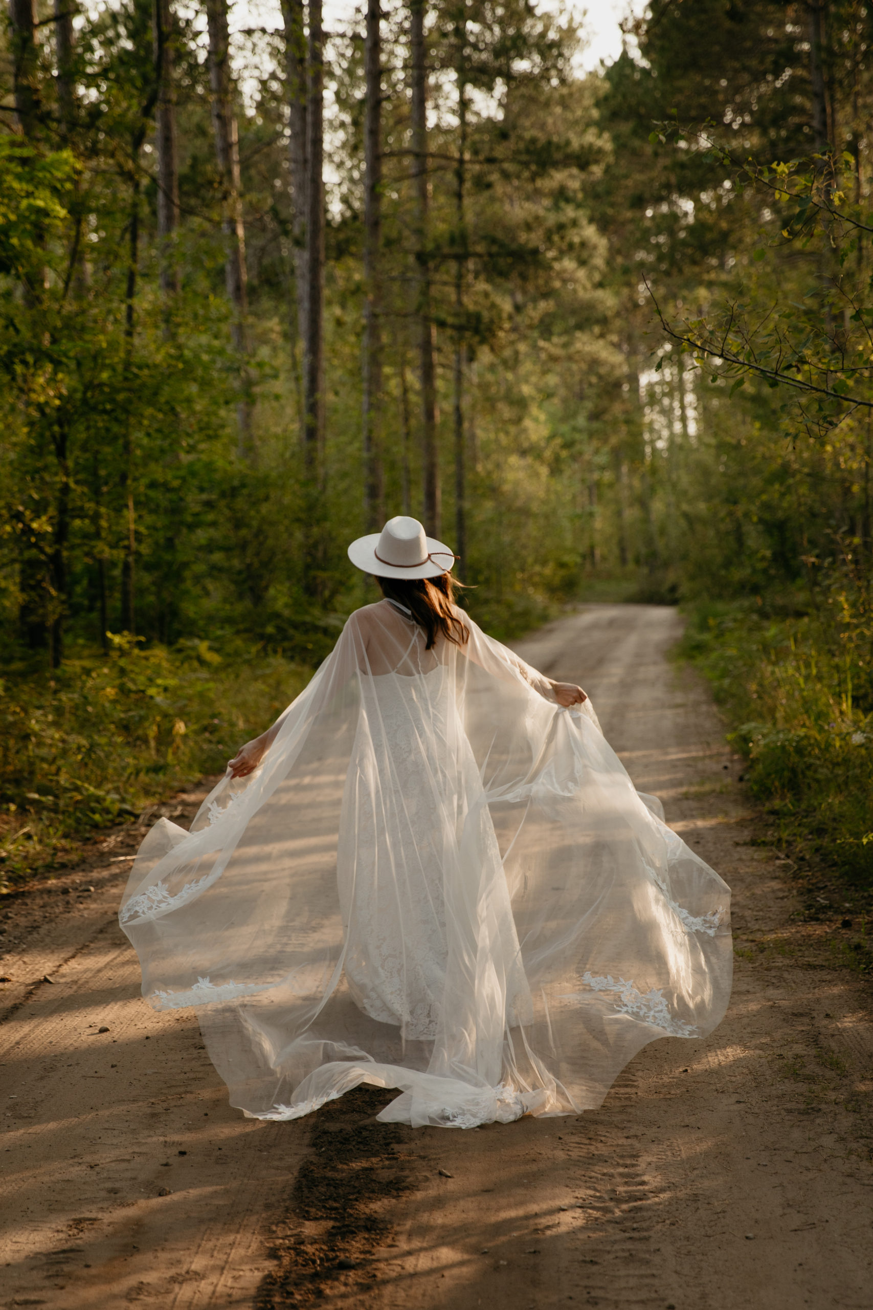 The prettiest boho bride with a wedding cape // Michigan Manistee Forest Elopement