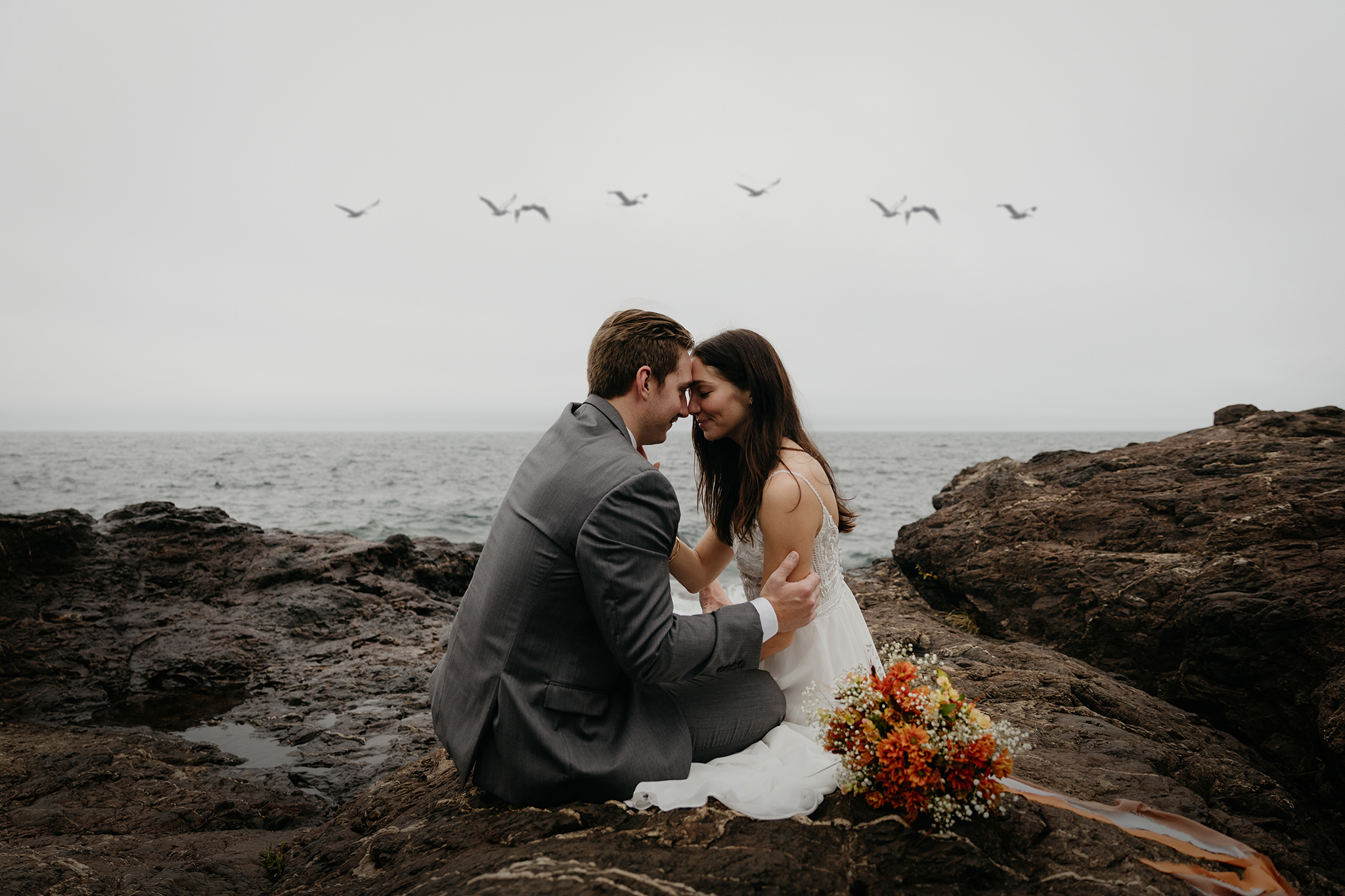 A couple embracing during their Black Rocks elopement in Michigan