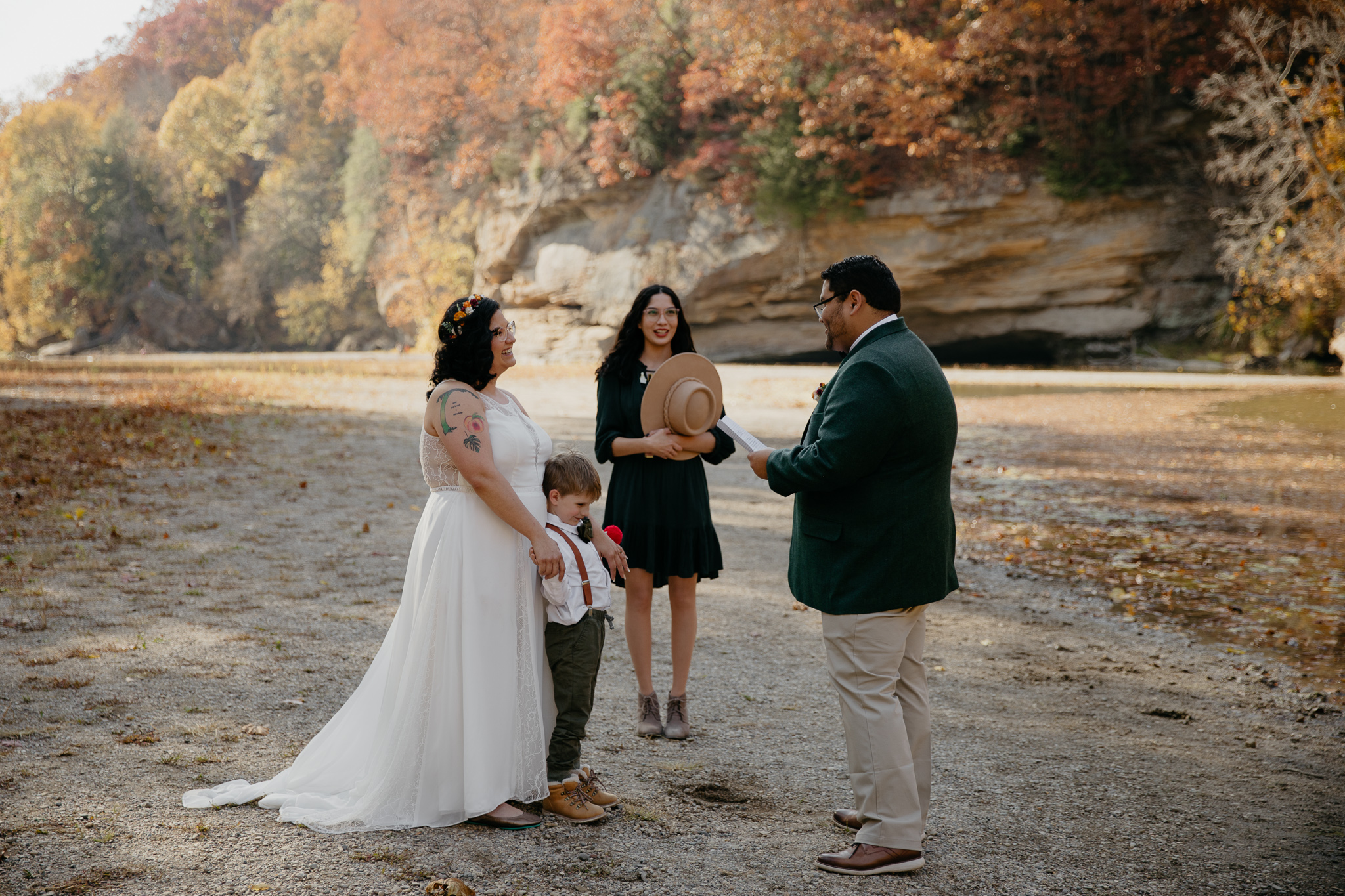 Two people exchanging vows in their elopement, overlooking Turkey Run State Park