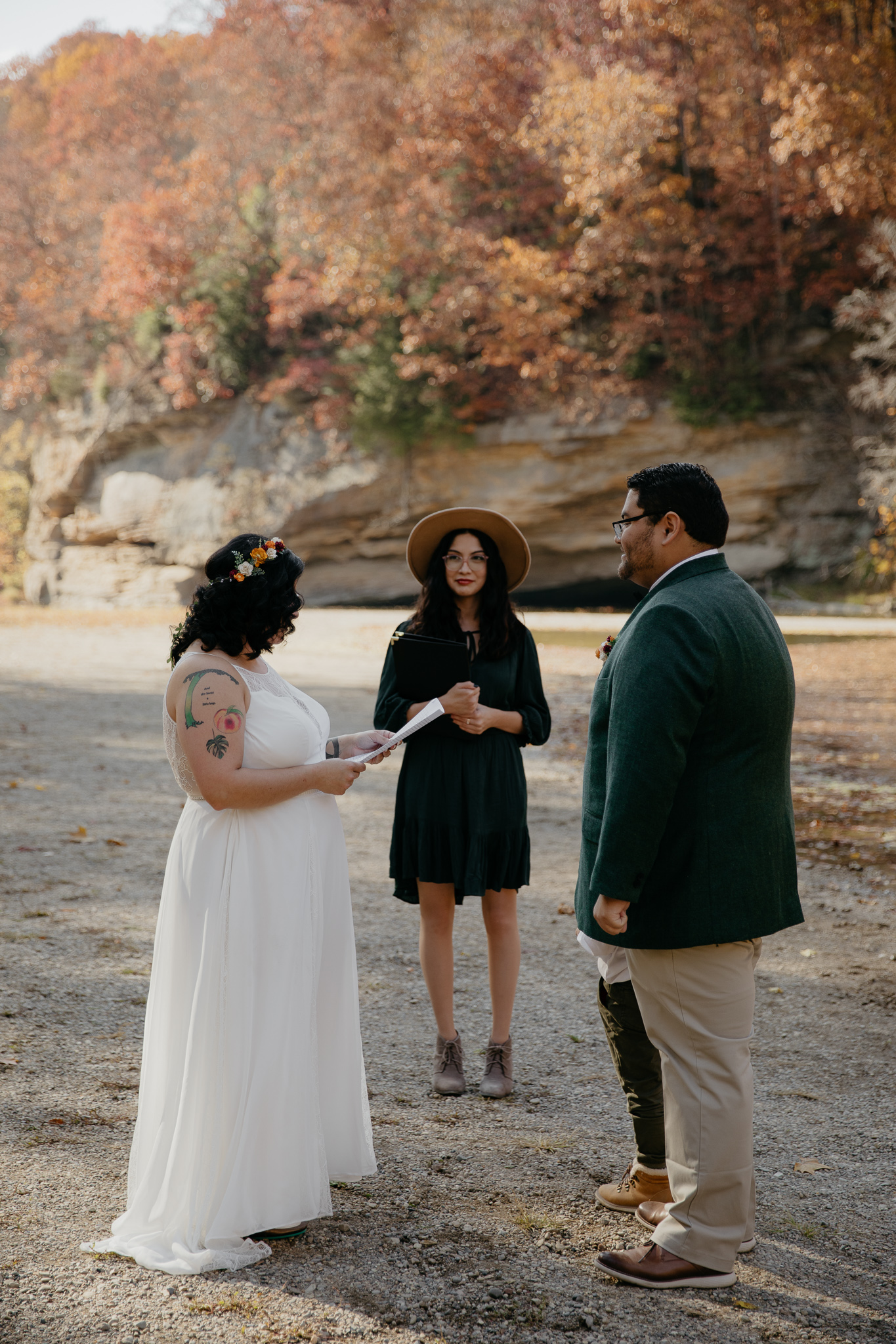 A couple eloping at Turkey Run State Park, shares vows overlooking Sugar Creek