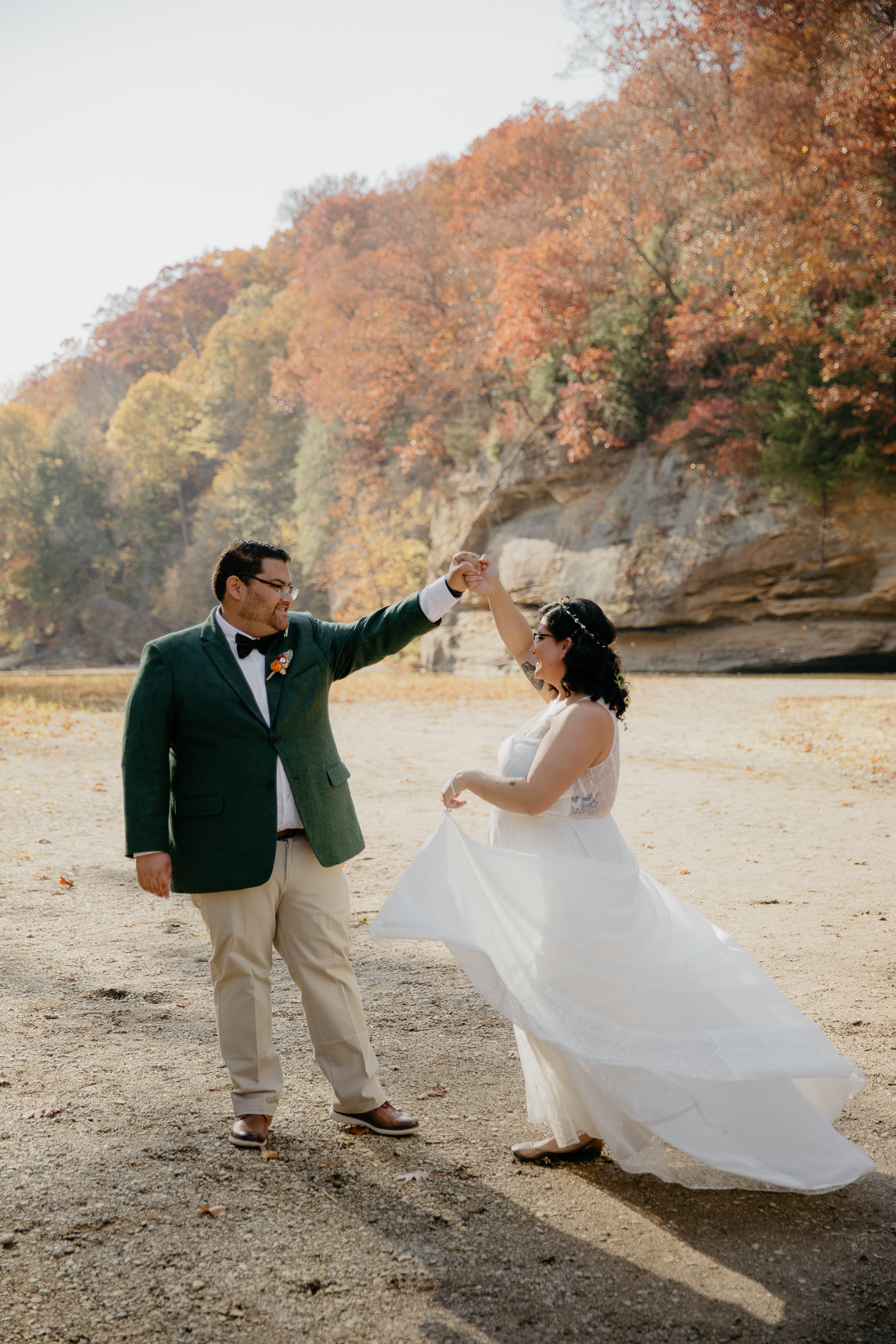 A bride and groom dancing by Sugar Creek, Turkey Run, after their elopement ceremony