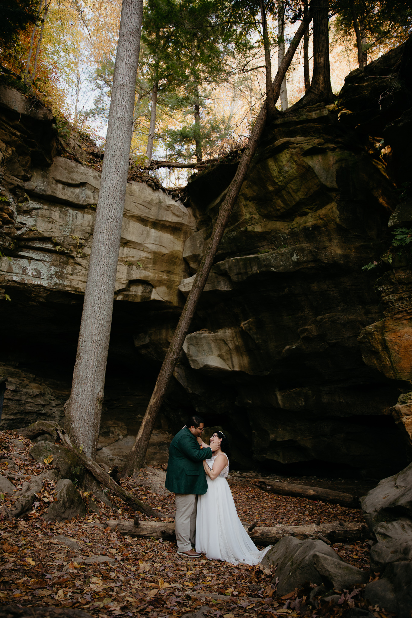 Bride and groom kissing at the Icebox, in Turkey Run State park after their elopement