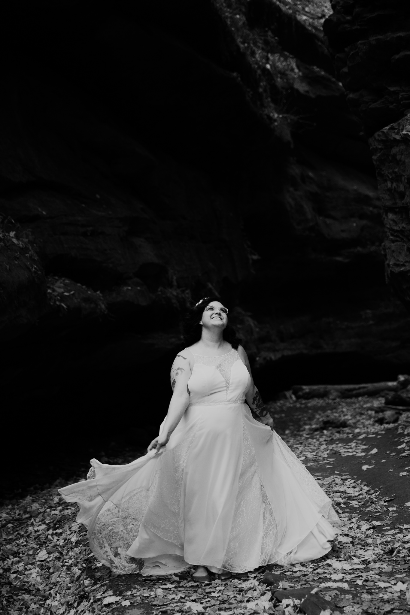 A bride dancing in fall leaves, within a canyon at Turkey Run State Park, Indiana