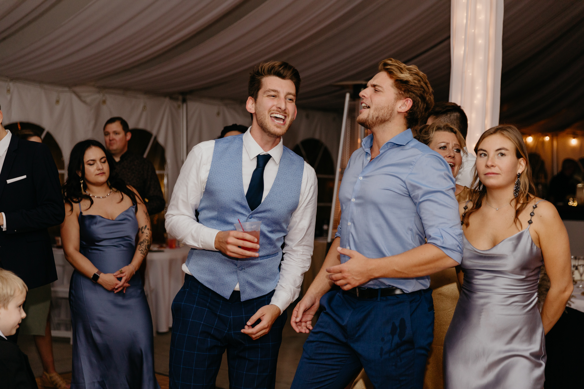Wedding guests dancing and singing on the dancefloor together at a Northfork Farm Wedding