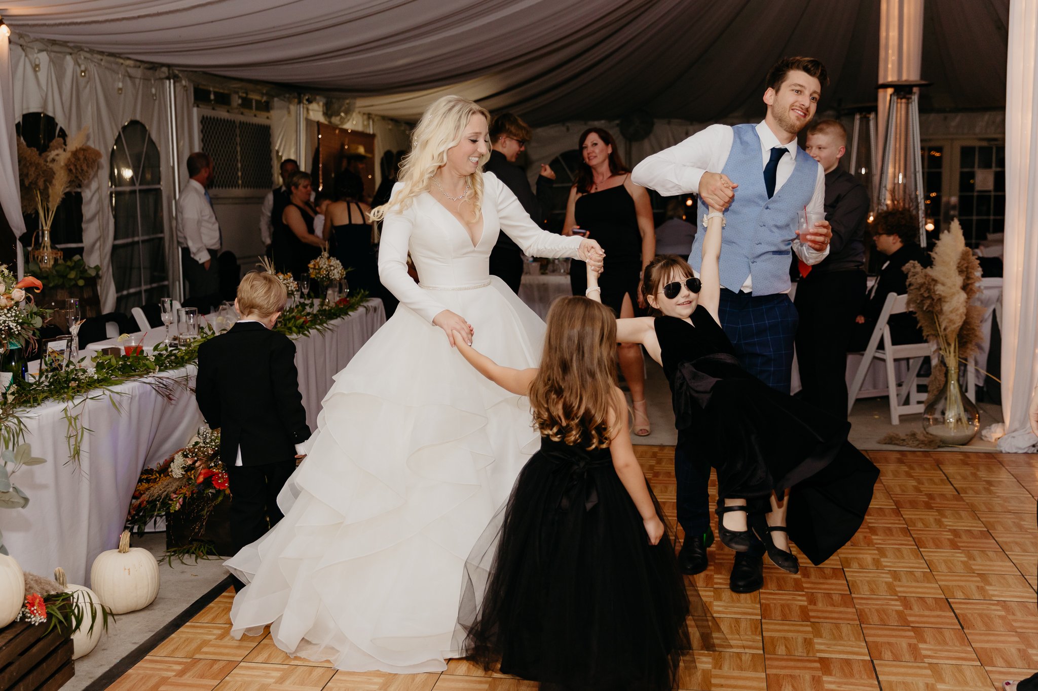 Wedding guests dancing and singing on the dancefloor together at a Northfork Farm Wedding