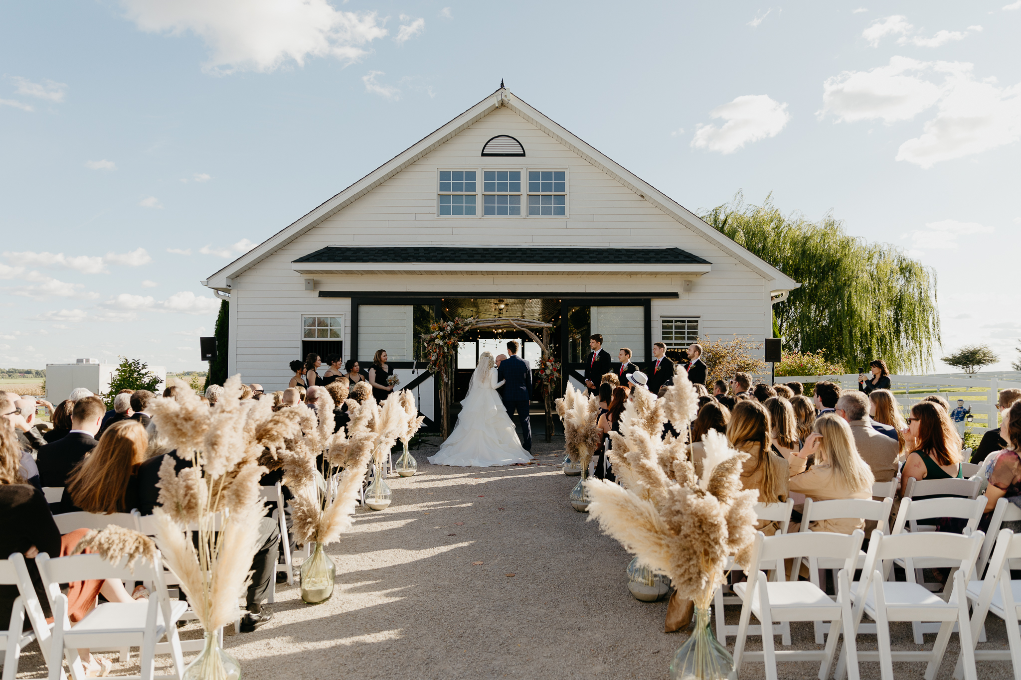 Wedding ceremony with pampas grass in October, at Northfork Farm, Oswego