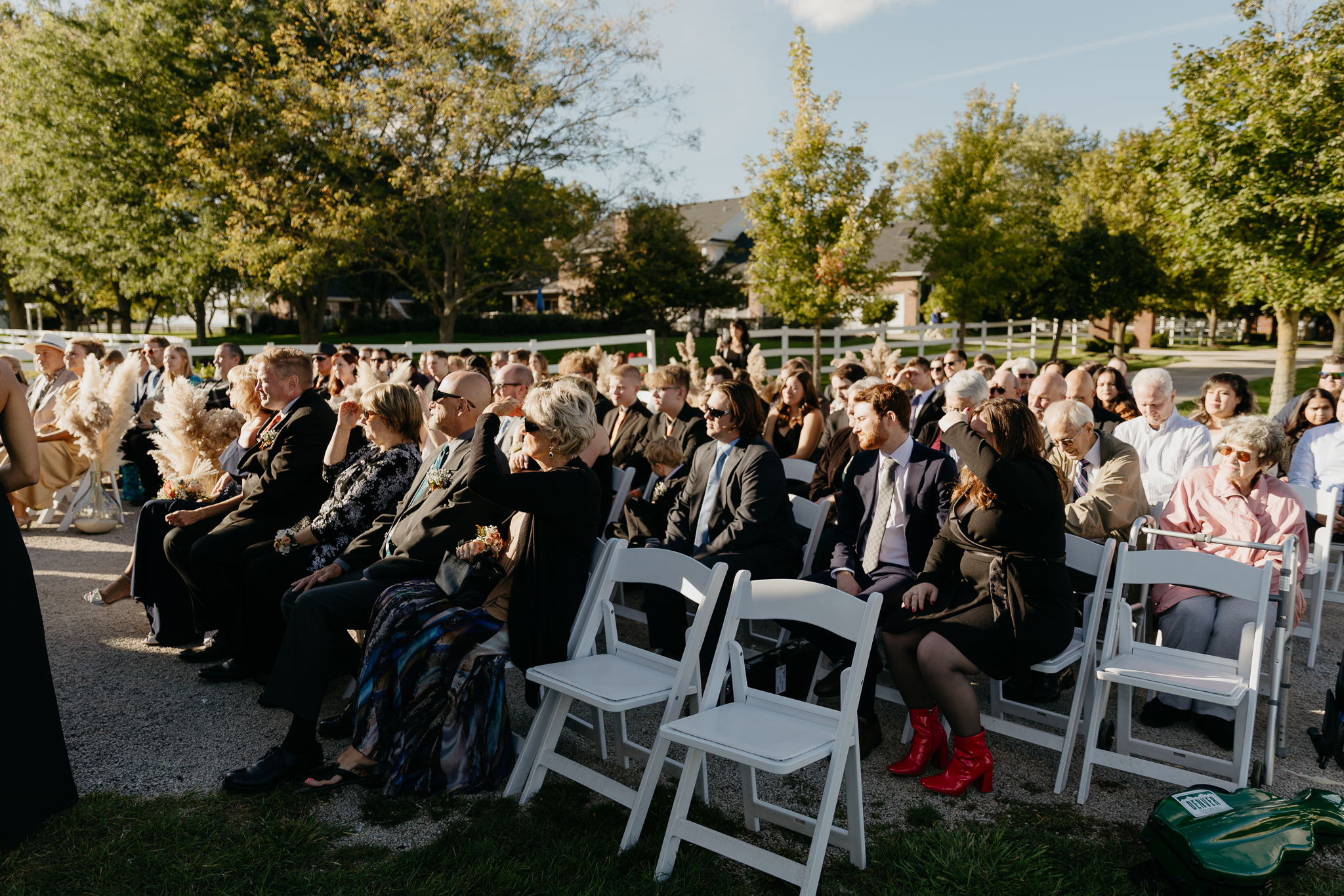 Wedding ceremony with guests watching in October, at Northfork Farm, Oswego