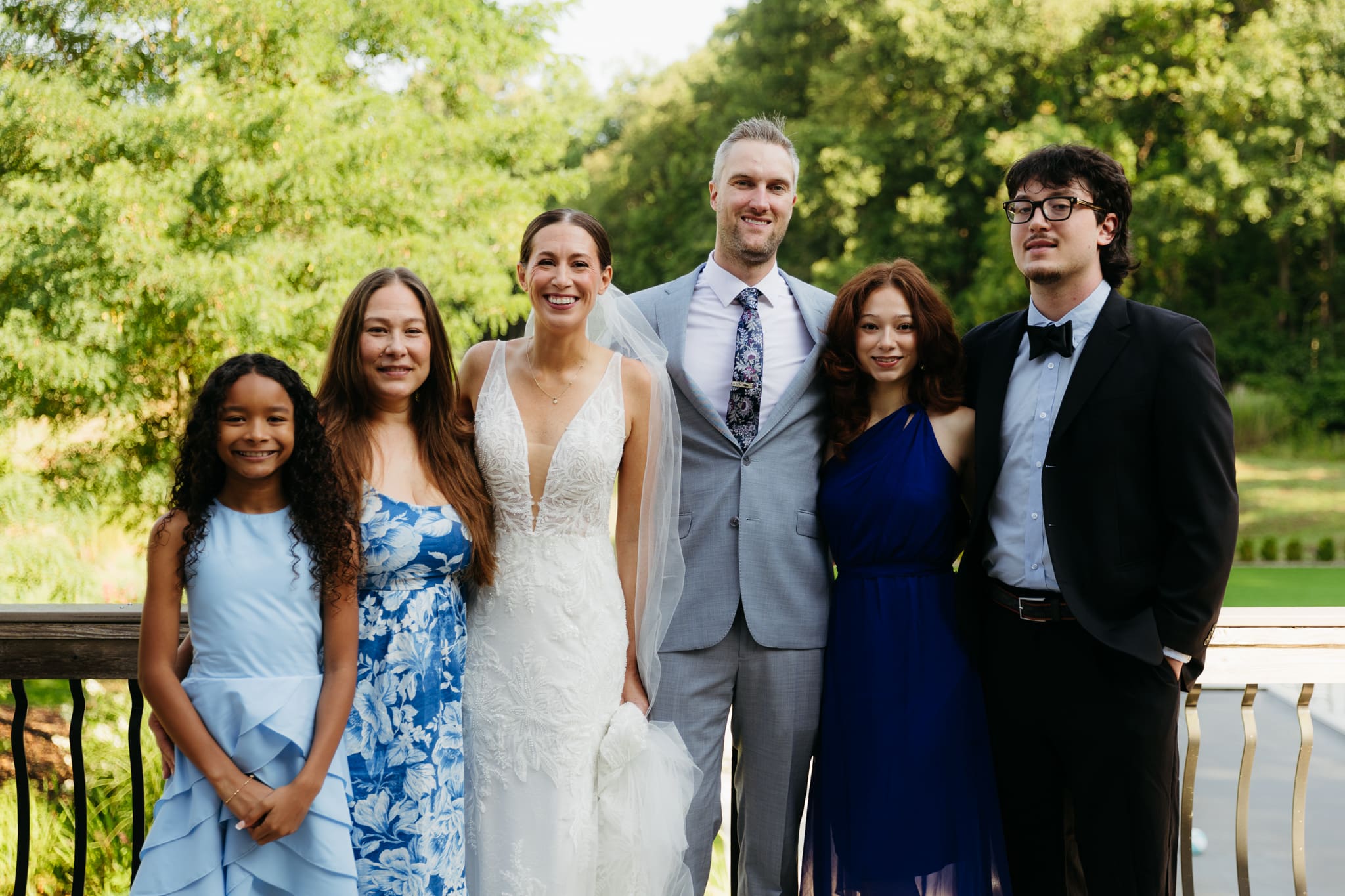 Formal group and family photos taken outdoors before the Lake Michigan Elopement ceremony