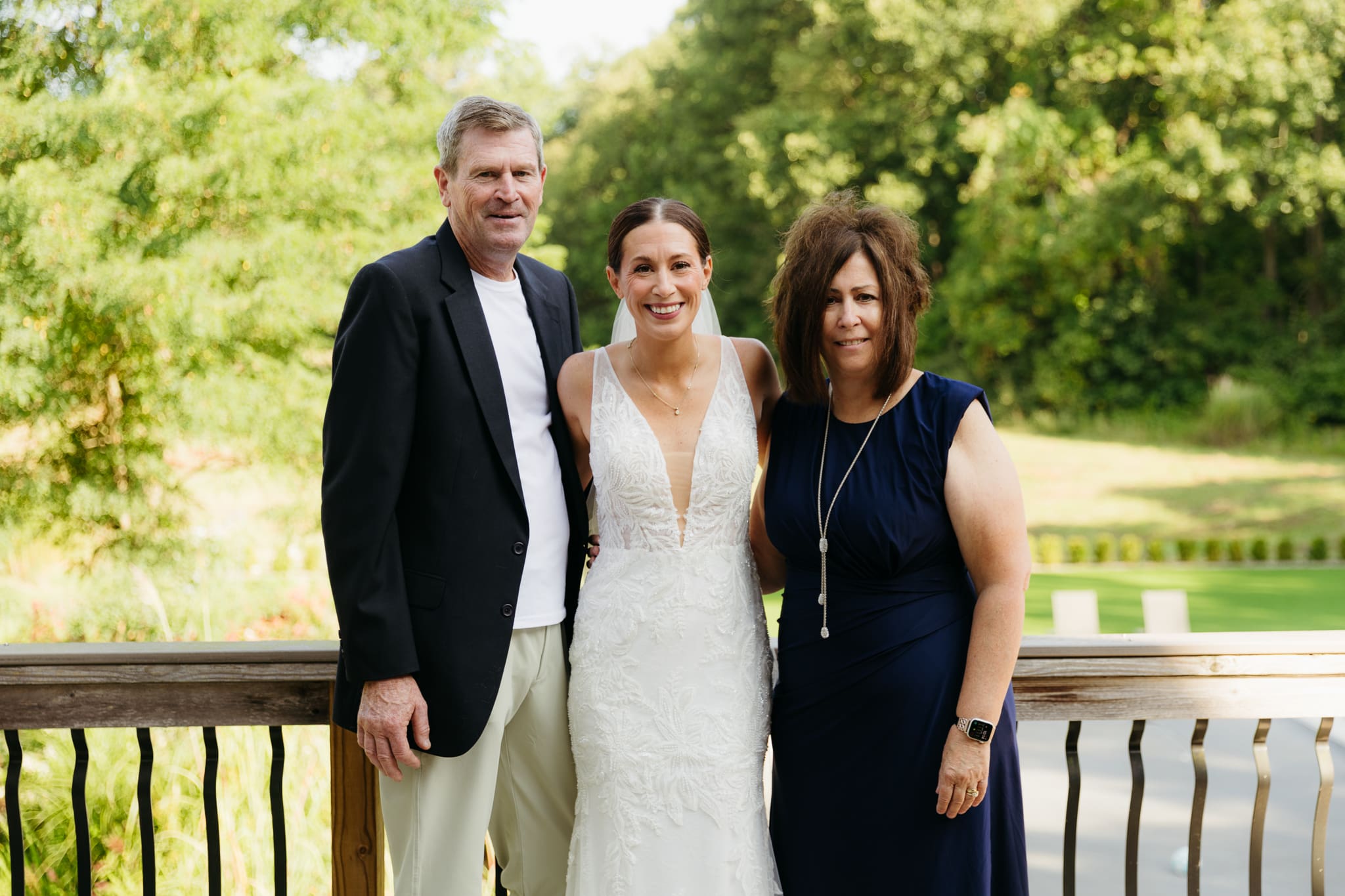 Formal group and family photos taken outdoors before the Lake Michigan Elopement ceremony