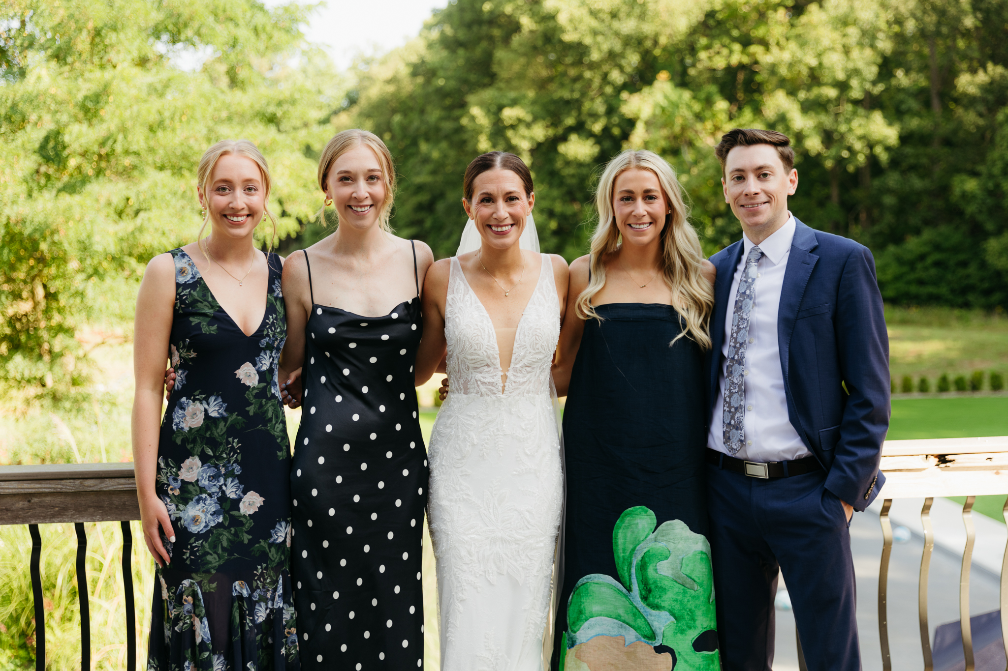 Formal group and family photos taken outdoors before the Lake Michigan Elopement ceremony