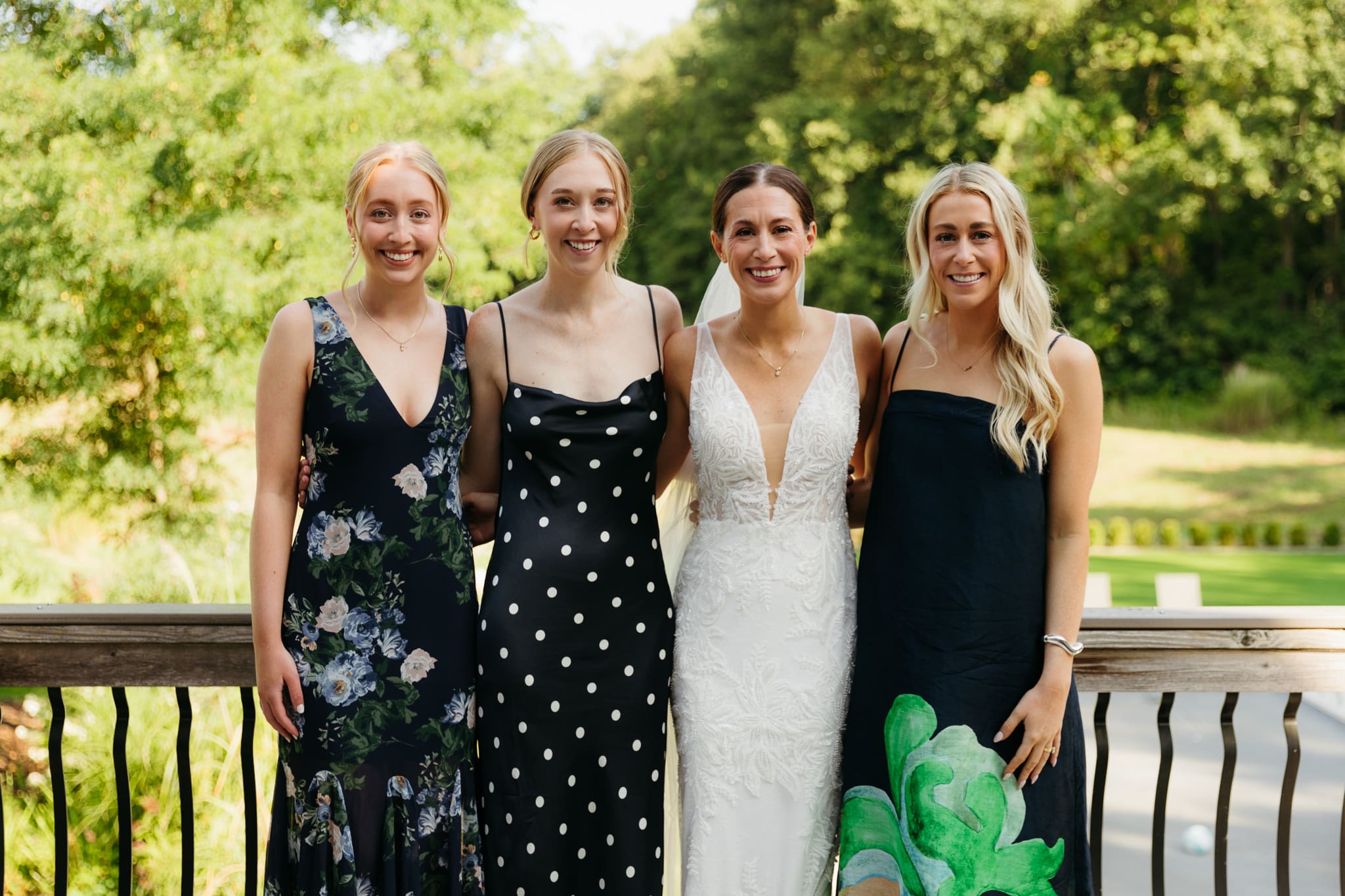 Formal group and family photos taken outdoors before the Lake Michigan Elopement ceremony