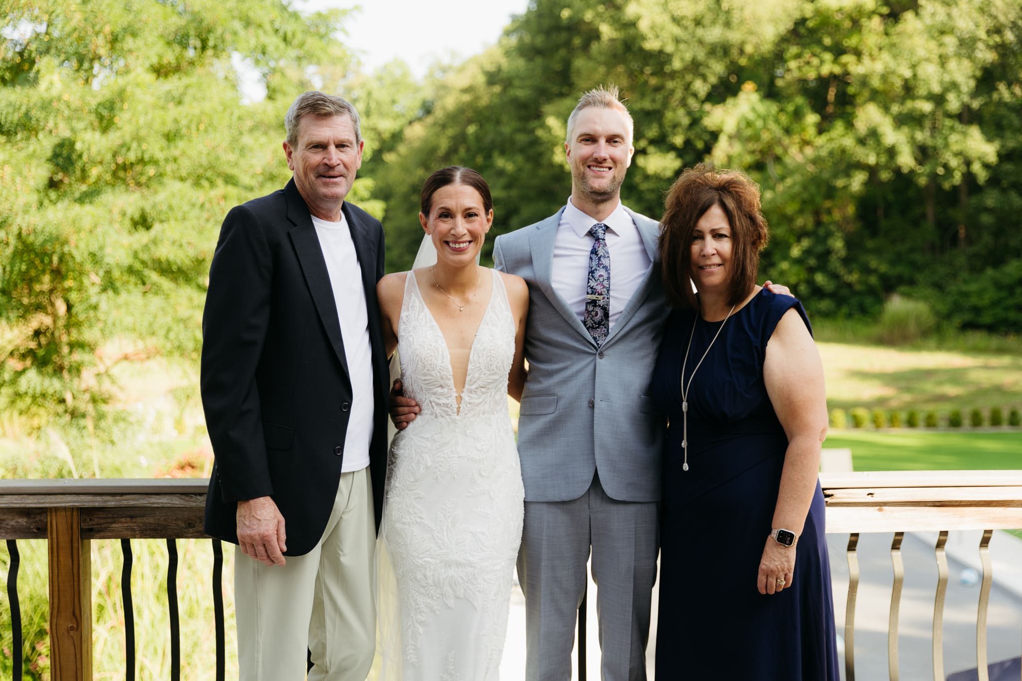 Formal group and family photos taken outdoors before the Lake Michigan Elopement ceremony