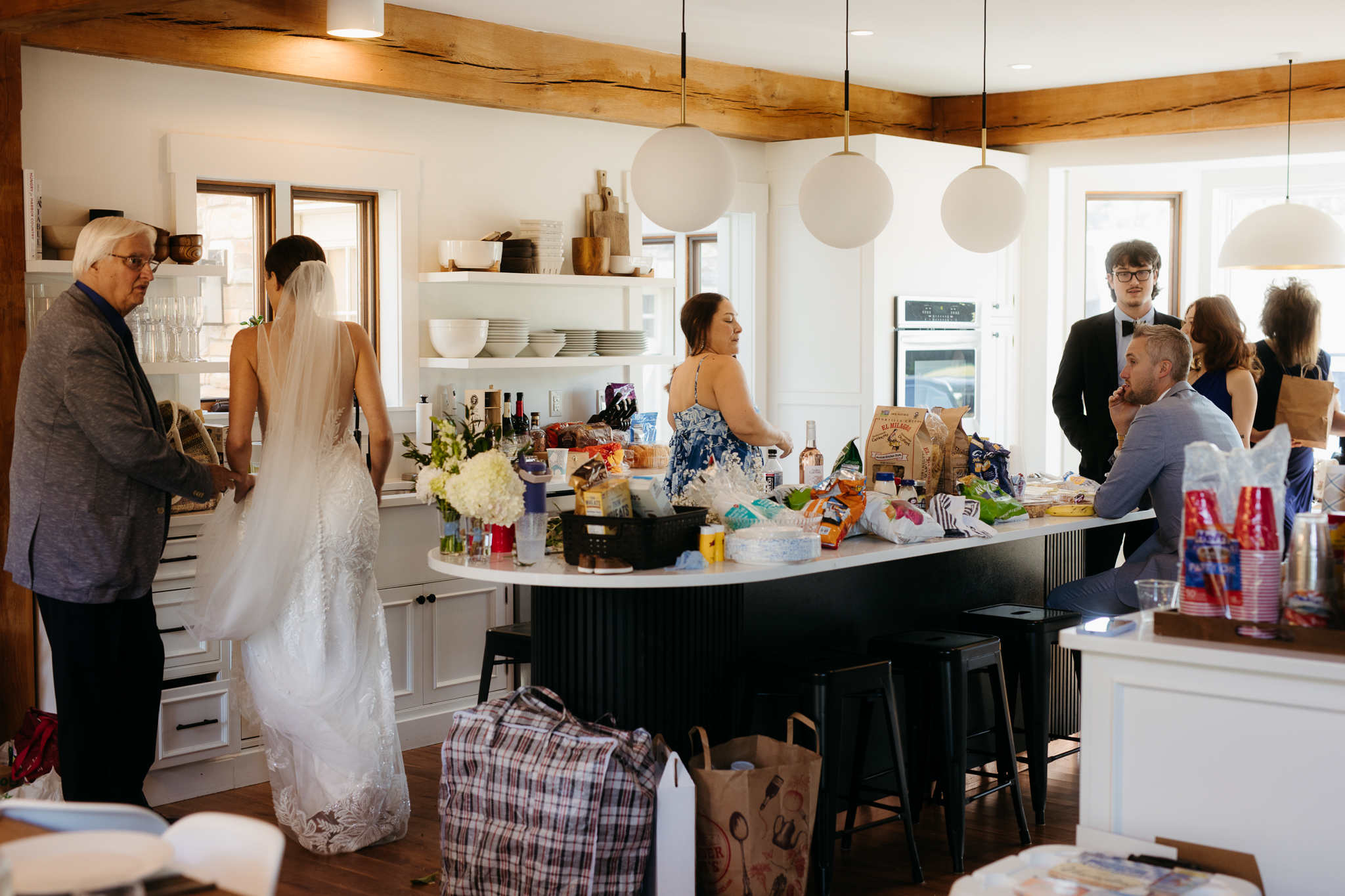 Group and family photos with bride and groom, hanging out at airbnb before heading out for the Lake Michigan wedding ceremony