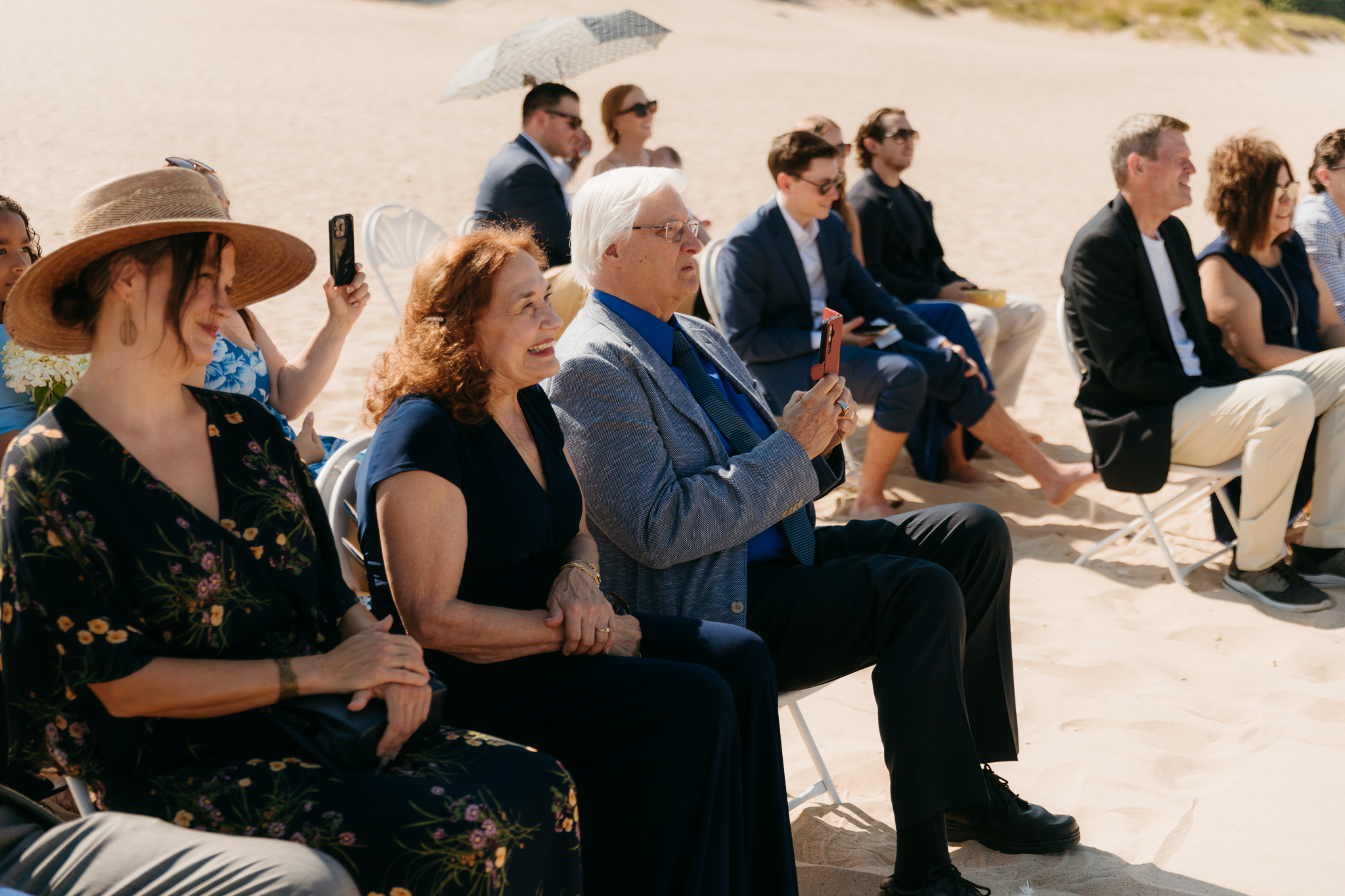 Bride and groom exchange vows on the beach during their Lake Michigan wedding ceremony at Warren Dunes State Park