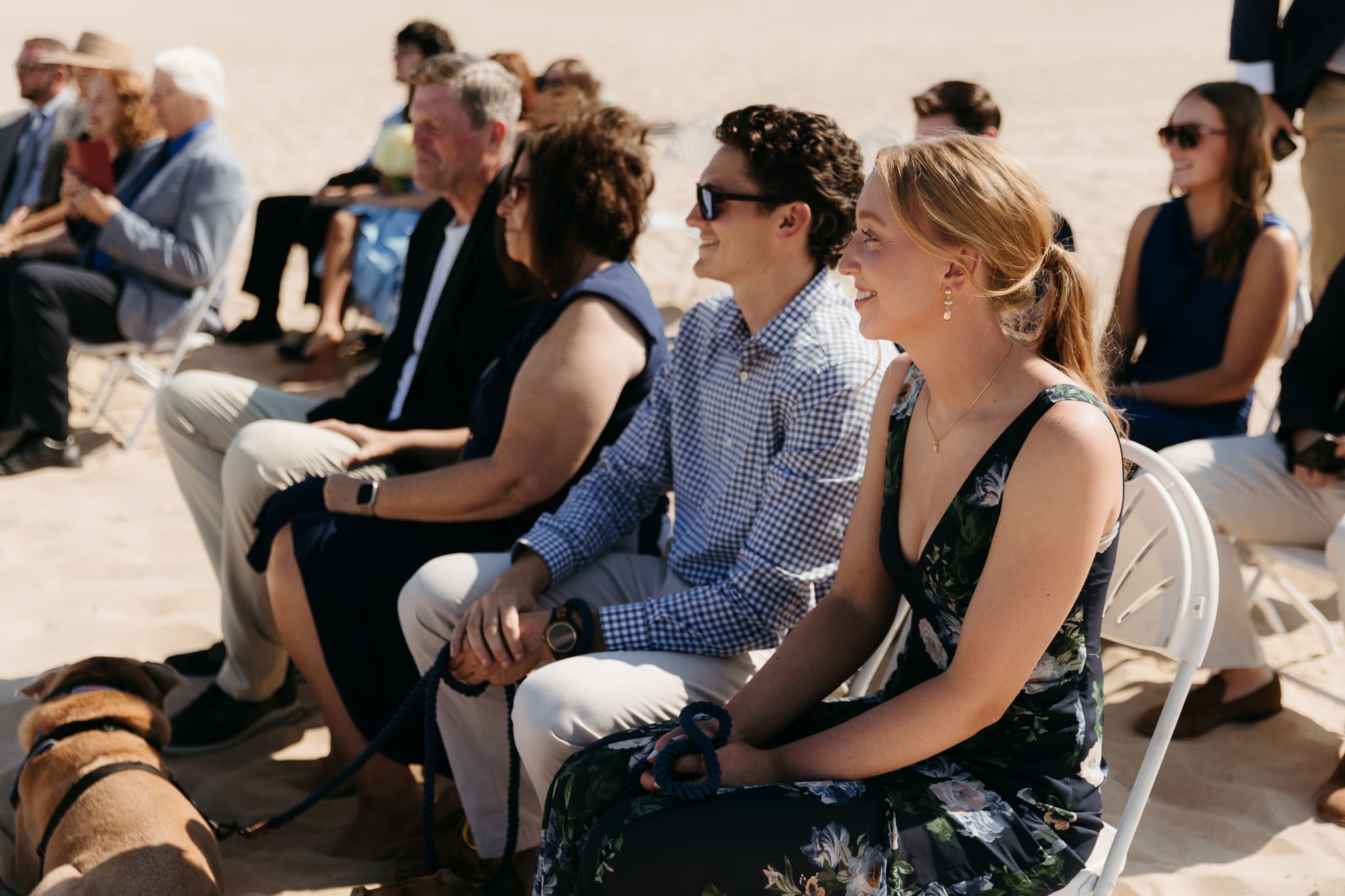 Bride and groom exchange vows on the beach during their Lake Michigan wedding ceremony at Warren Dunes State Park