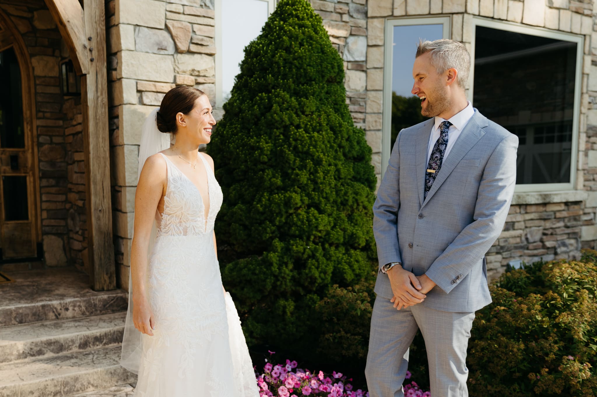 A bride and groom share a first look before their beach elopement ceremony at Warren Dunes State Park