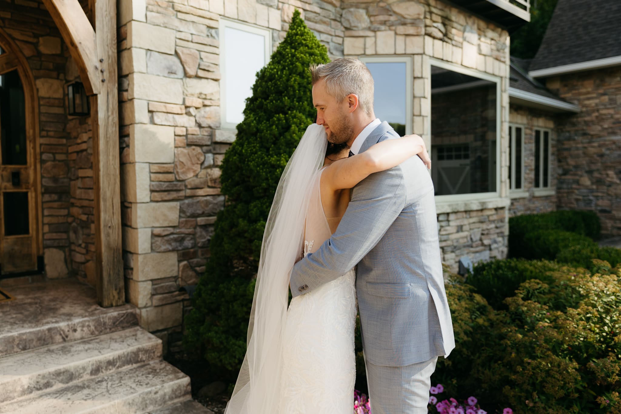 A bride and groom share a first look before their beach elopement ceremony at Warren Dunes State Park