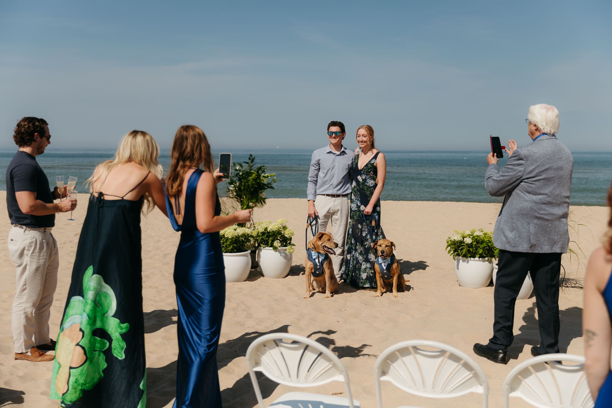 Wedding guests mingling during a beach elopement at Warren Dunes State Park