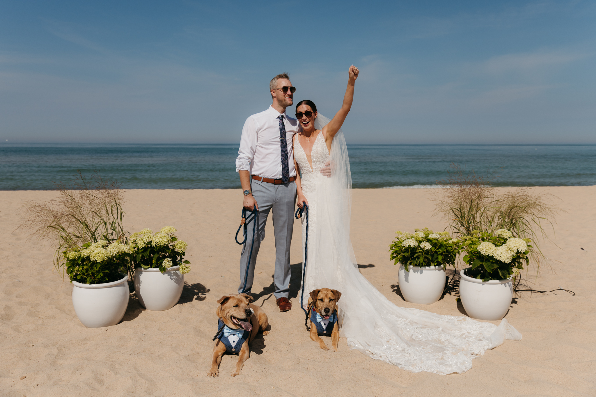 Bride and groom pose with their dogs after their Warren Dunes elopement