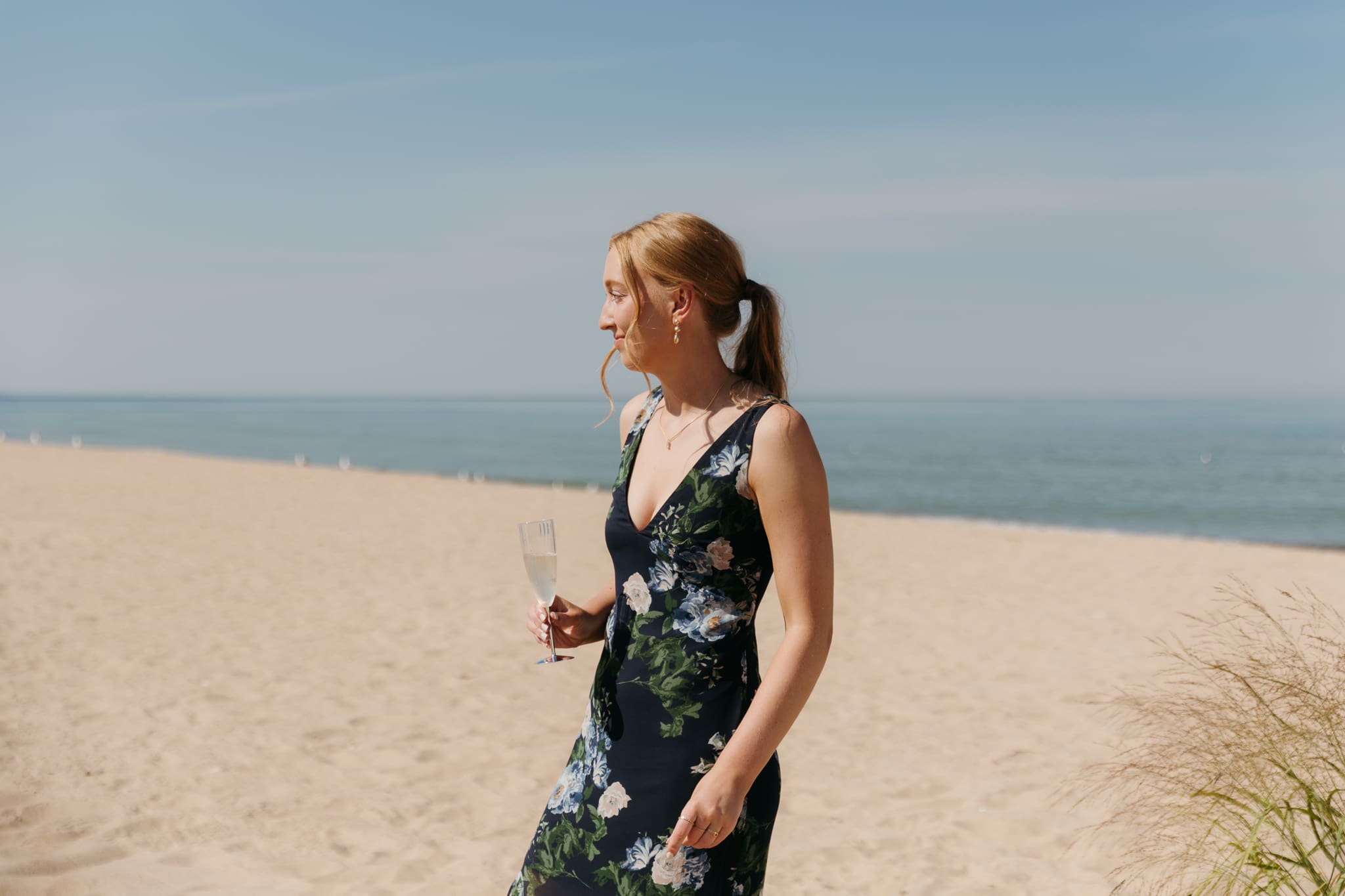 Wedding guests mingling during a beach elopement at Warren Dunes State Park
