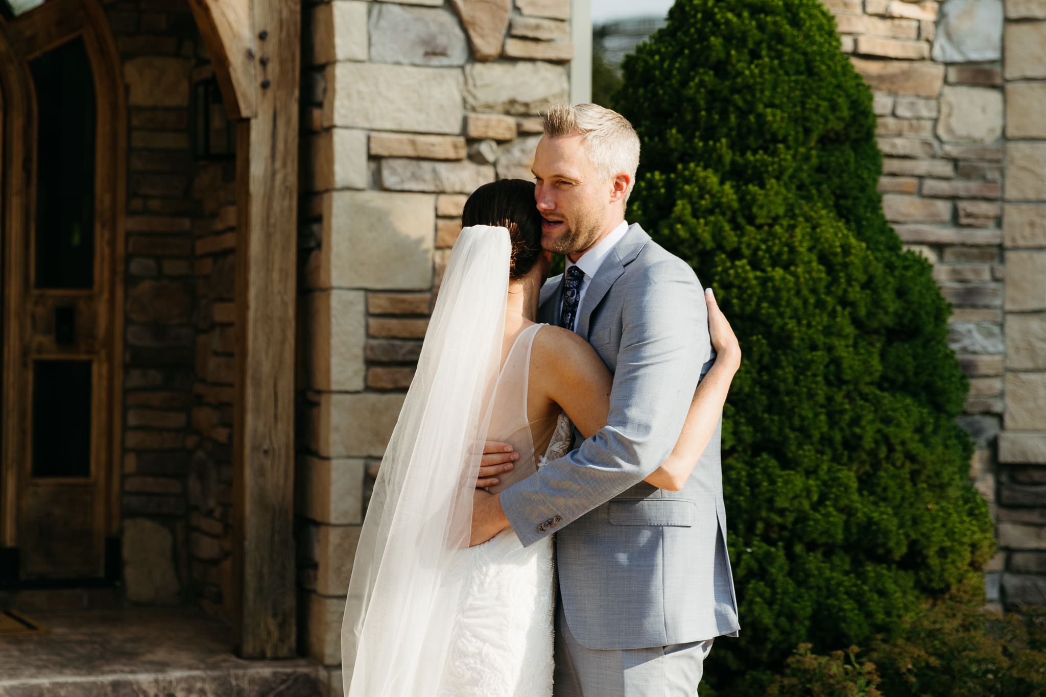 A bride and groom share a first look before their beach elopement ceremony at Warren Dunes State Park