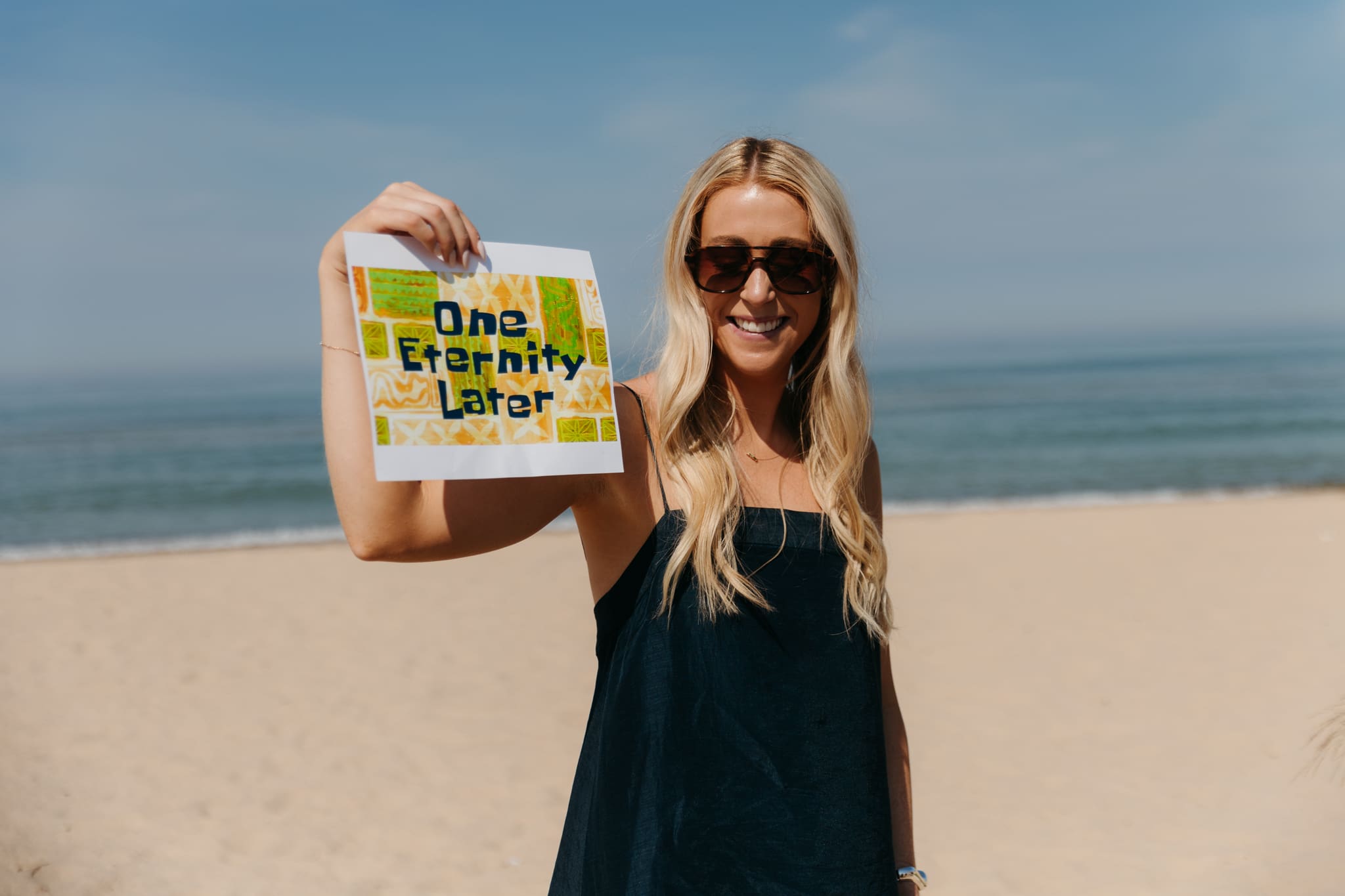 Wedding guests mingling during a beach elopement at Warren Dunes State Park