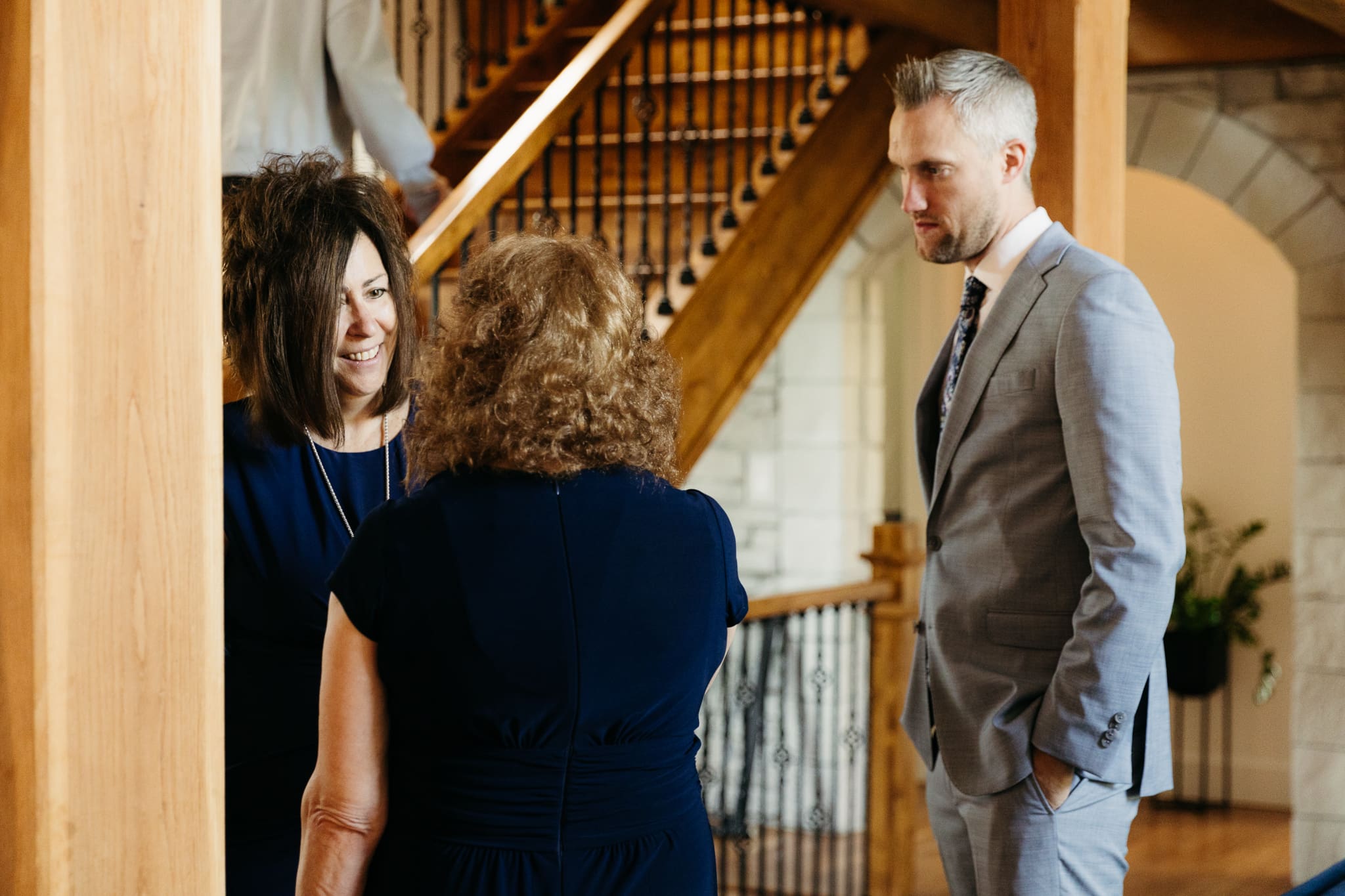 Group and family photos with bride and groom, hanging out at airbnb before heading out for the Lake Michigan wedding ceremony