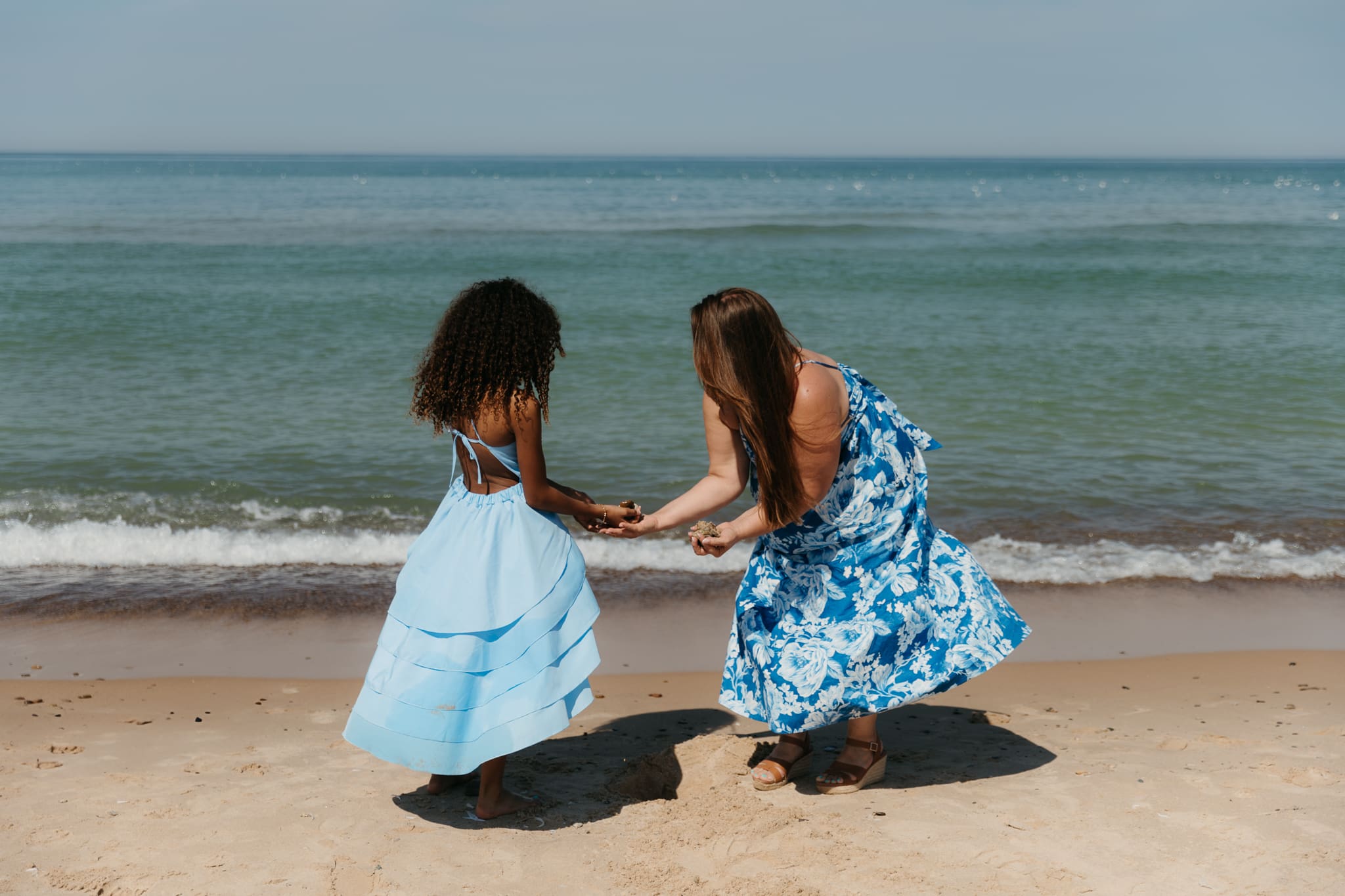 Wedding guests mingling during a beach elopement at Warren Dunes State Park