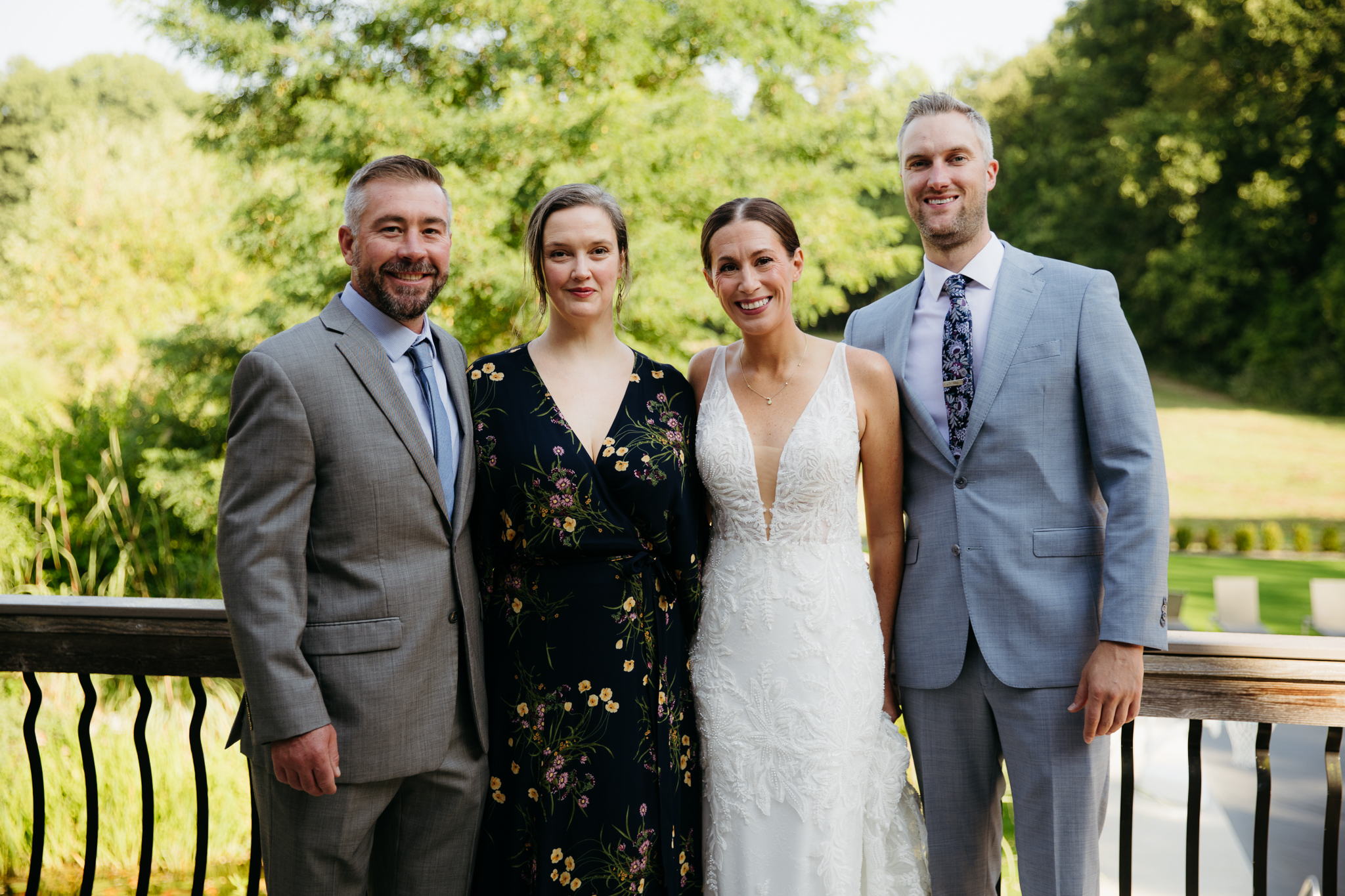 Formal group and family photos taken outdoors before the Lake Michigan Elopement ceremony