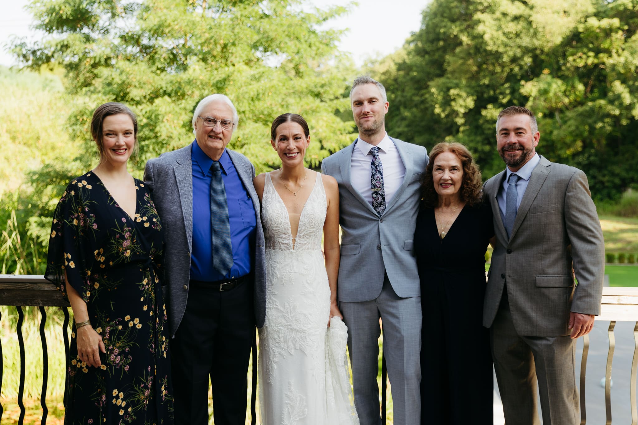 Formal group and family photos taken outdoors before the Lake Michigan Elopement ceremony