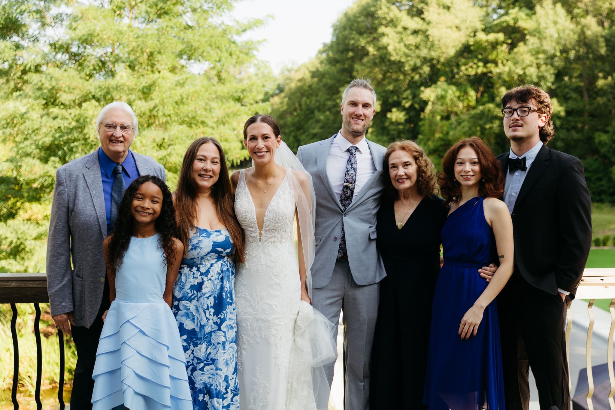 Formal group and family photos taken outdoors before the Lake Michigan Elopement ceremony