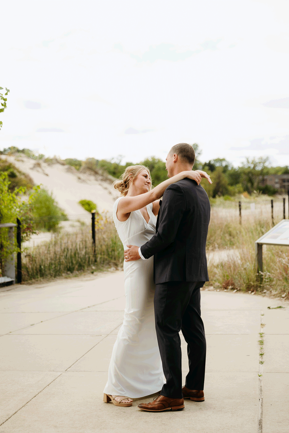Bride and groom share a first dance during their wedding at Indiana Dunes National Park
