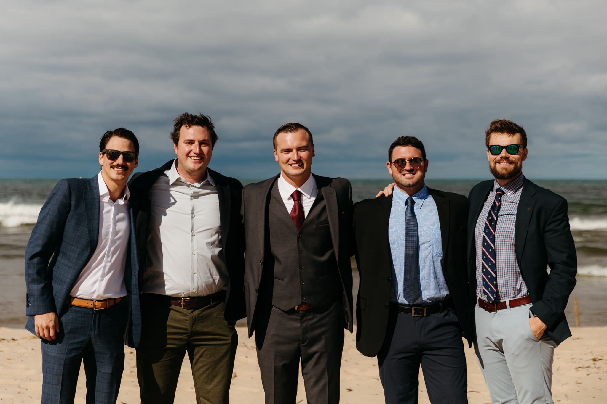 Family and friend group photos at the beach of Lake Michigan for a wedding at Indiana Dunes National Park