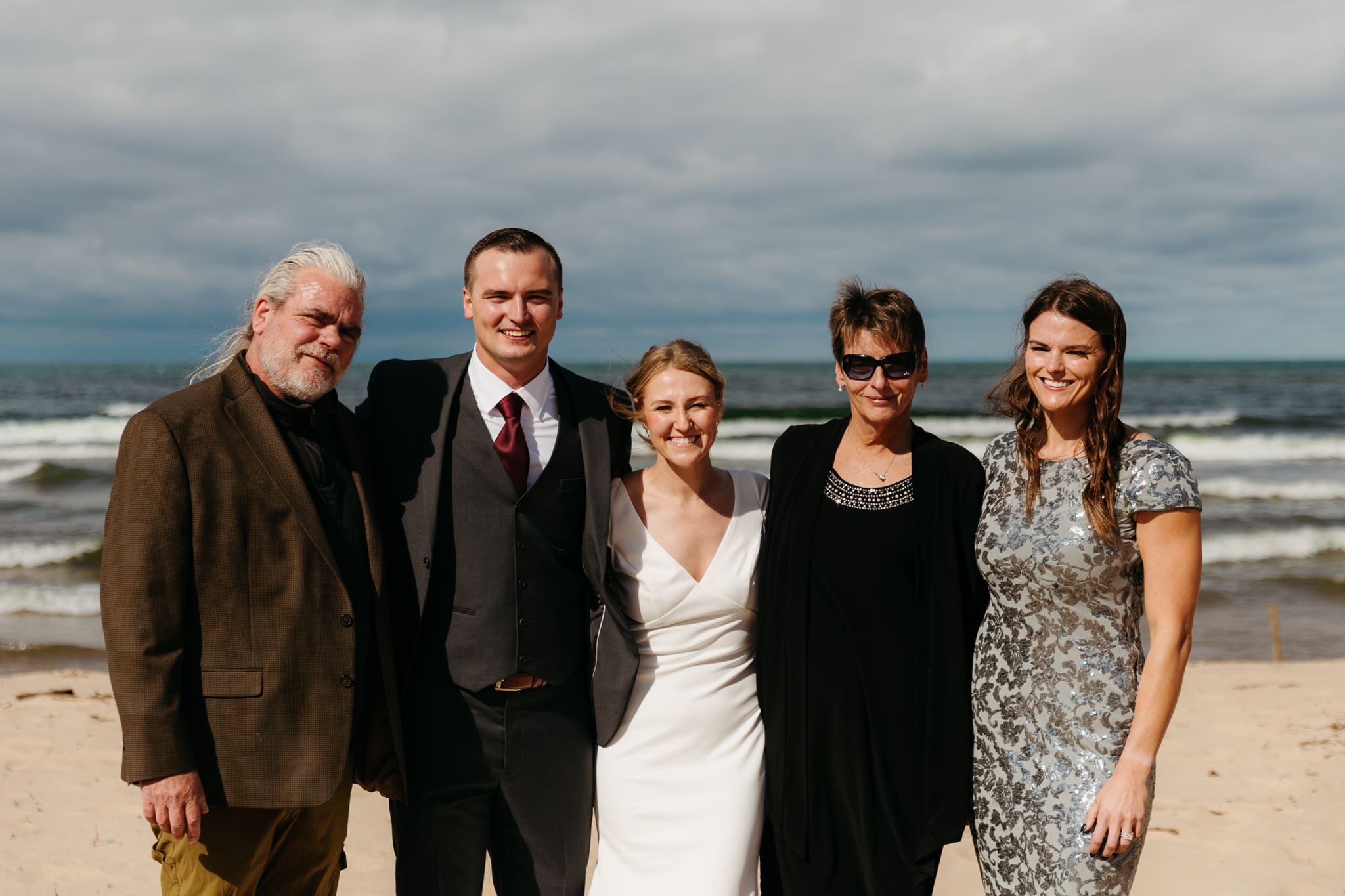 Family and friend group photos at the beach of Lake Michigan for a wedding at Indiana Dunes National Park
