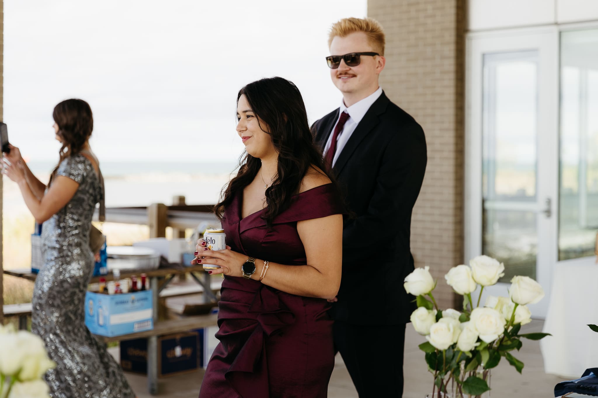 Bride and groom hanging out with family and friends during their outdoor wedding at Indiana Dunes National Park