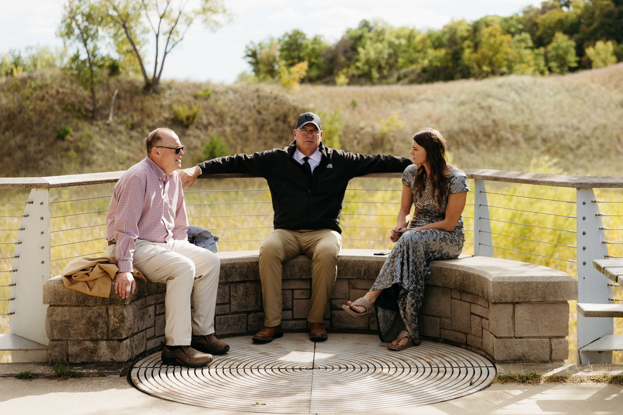 Bride and groom hanging out with family and friends during their outdoor wedding at Indiana Dunes National Park