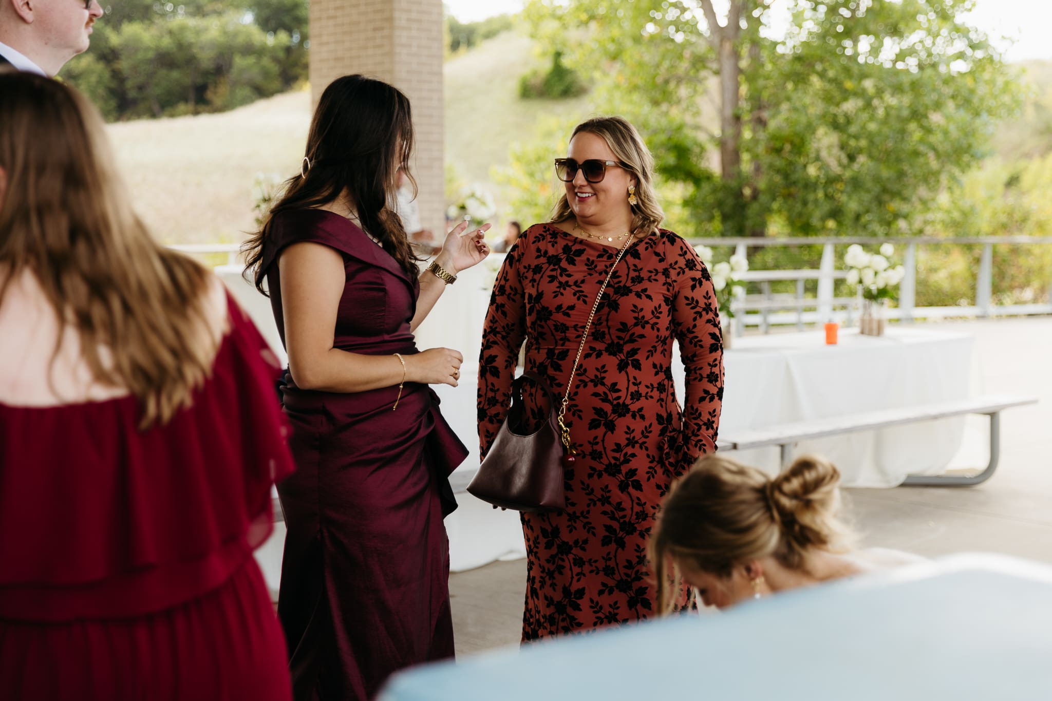 Bride and groom hanging out with family and friends during their outdoor wedding at Indiana Dunes National Park