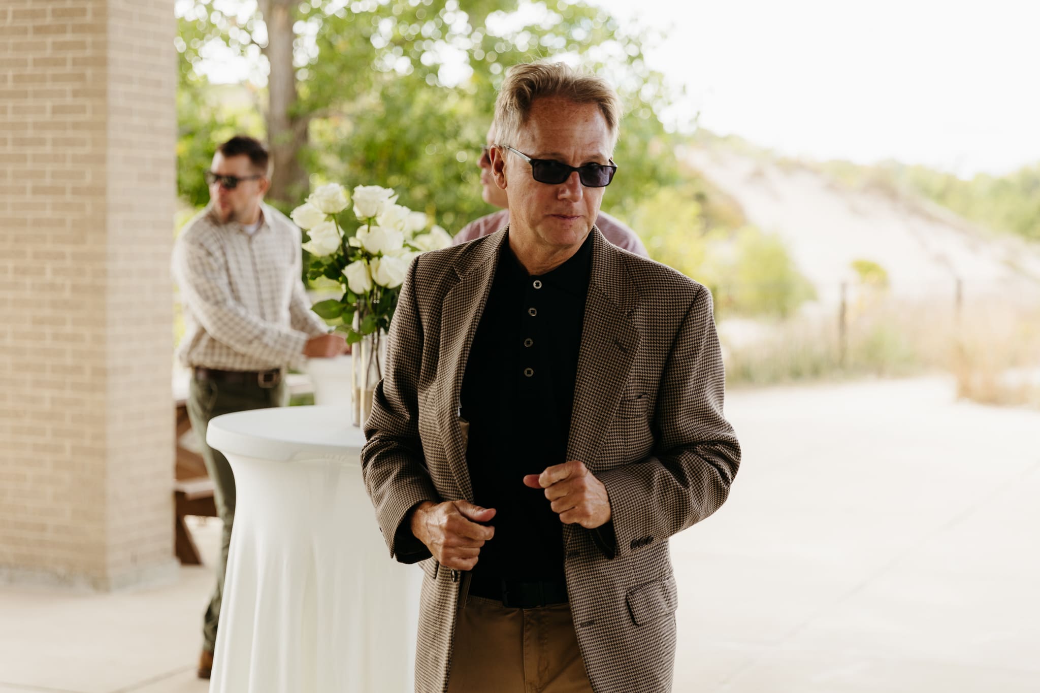 Bride and groom hanging out with family and friends during their outdoor wedding at Indiana Dunes National Park