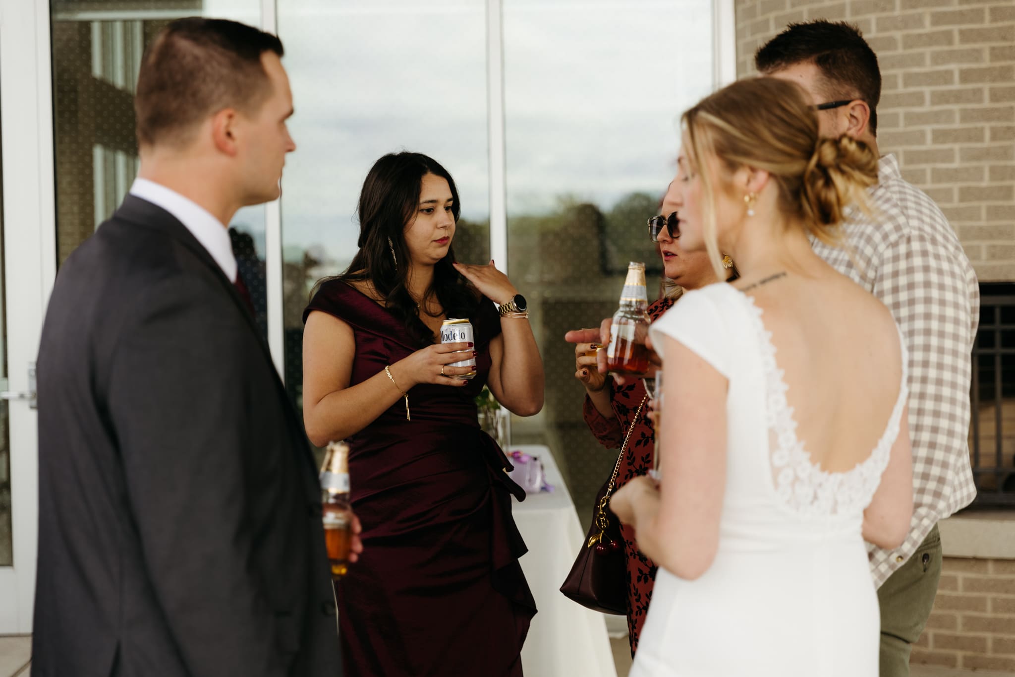 Bride and groom hanging out with family and friends during their outdoor wedding at Indiana Dunes National Park