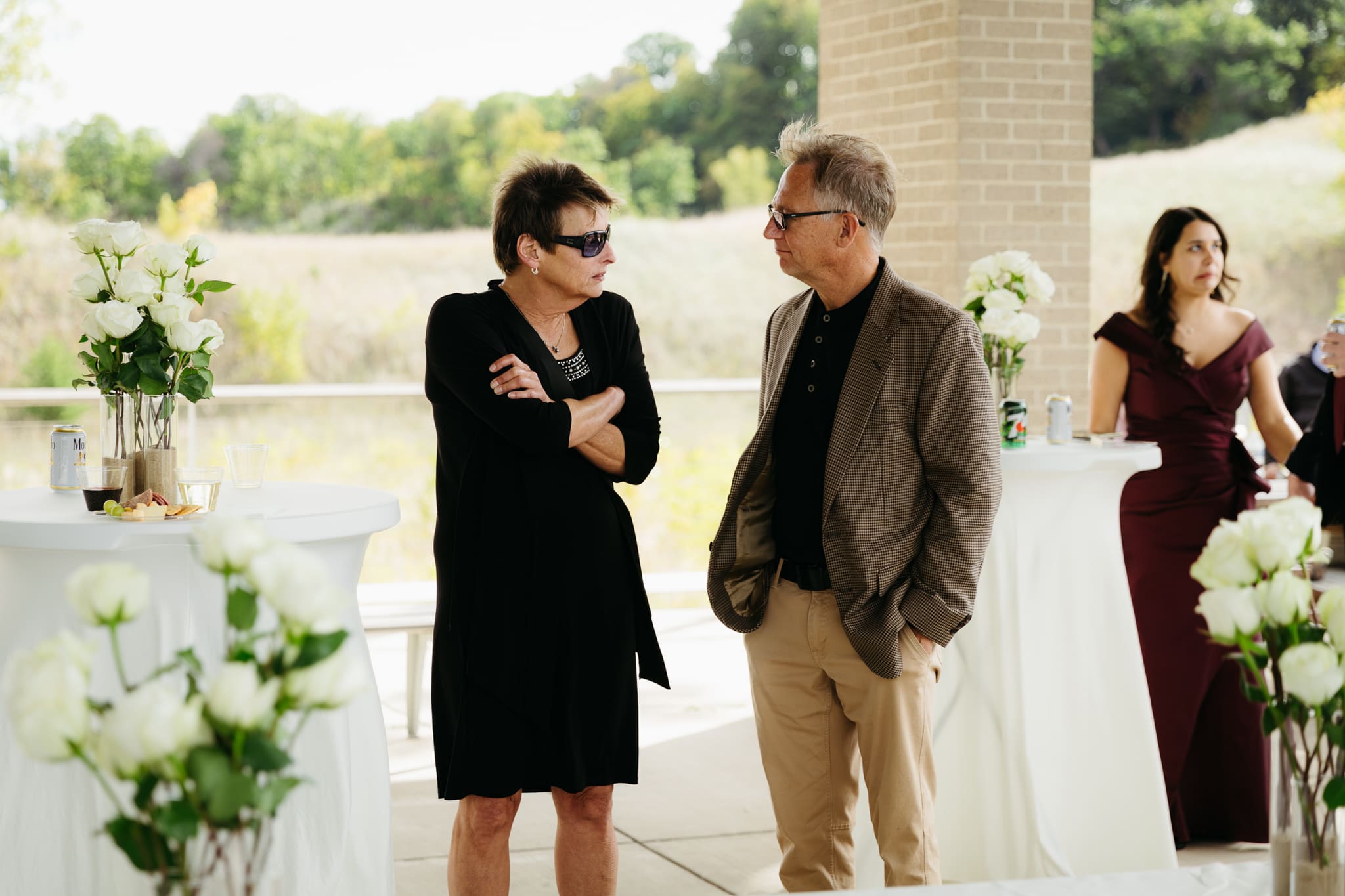 Bride and groom hanging out with family and friends during their outdoor wedding at Indiana Dunes National Park