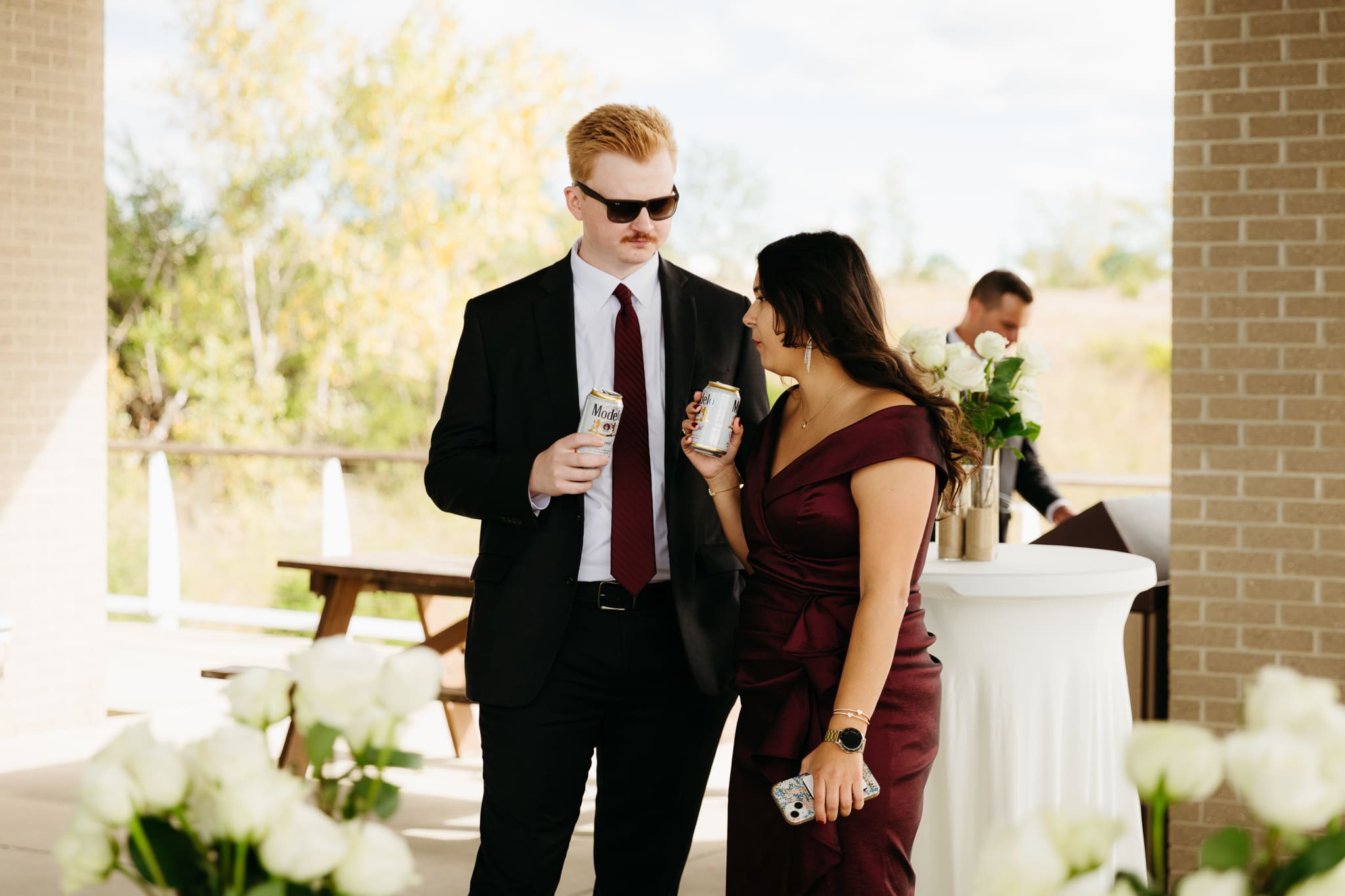 Bride and groom hanging out with family and friends during their outdoor wedding at Indiana Dunes National Park