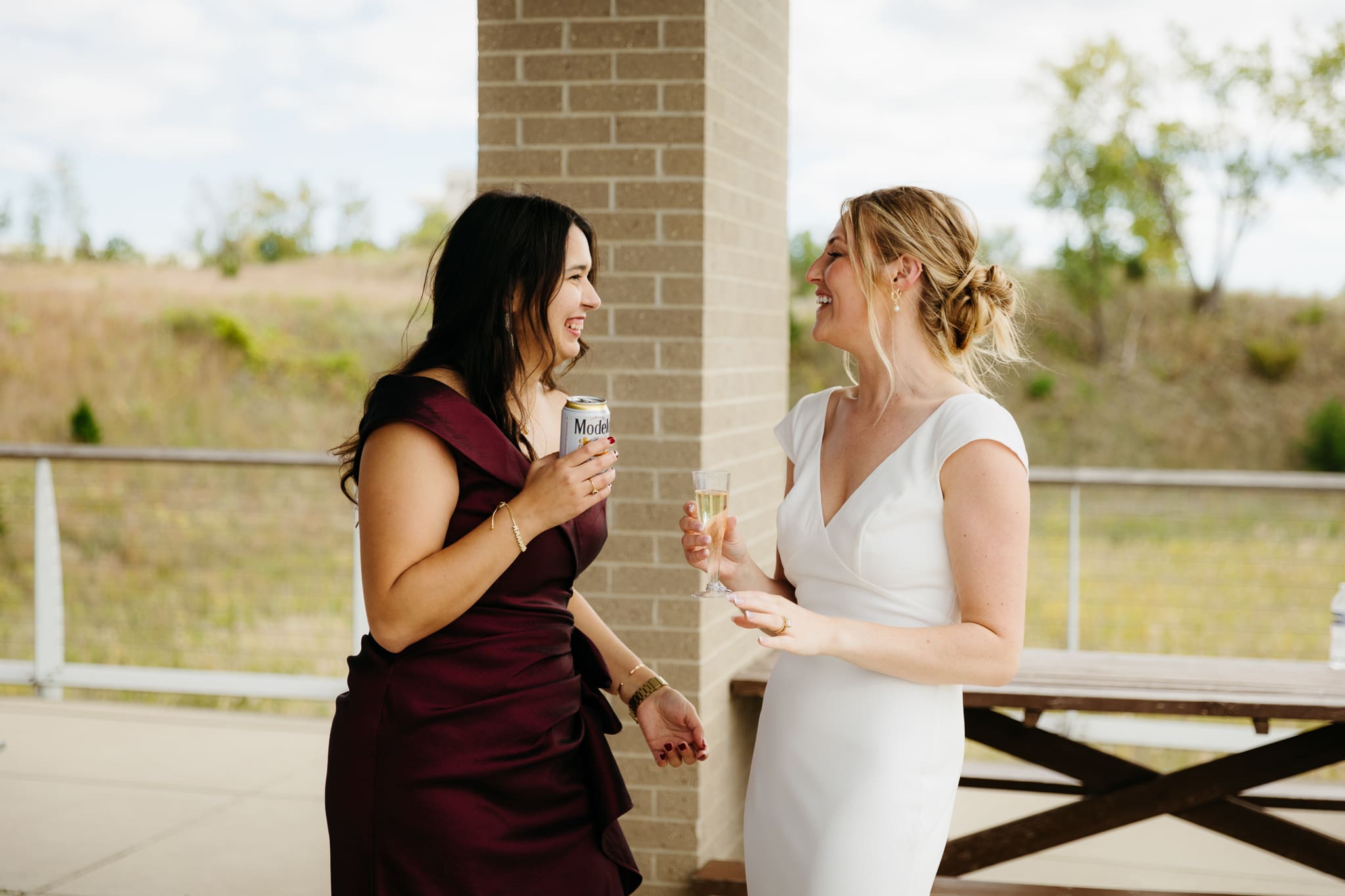 Bride and groom hanging out with family and friends during their outdoor wedding at Indiana Dunes National Park