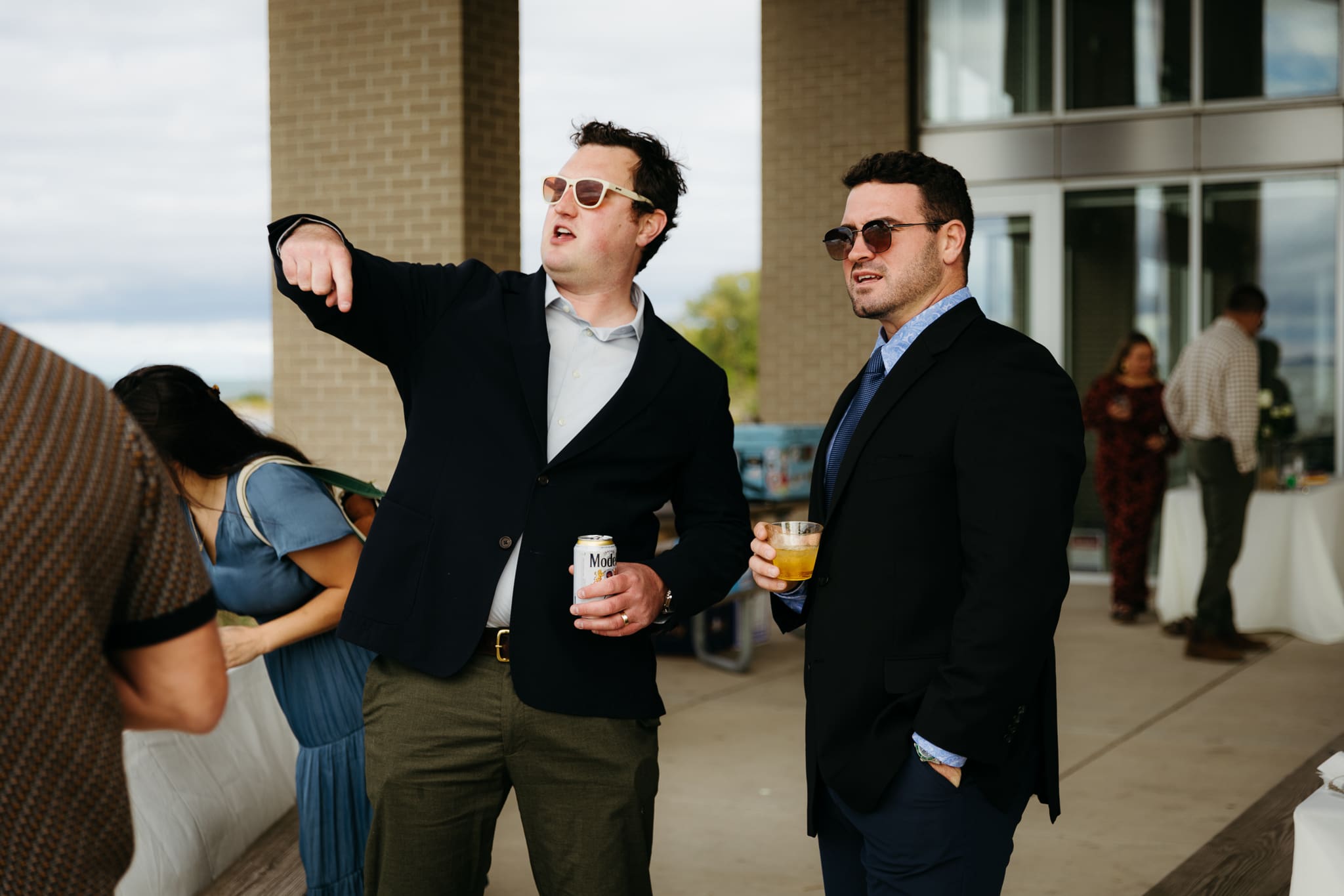 Bride and groom hanging out with family and friends during their outdoor wedding at Indiana Dunes National Park